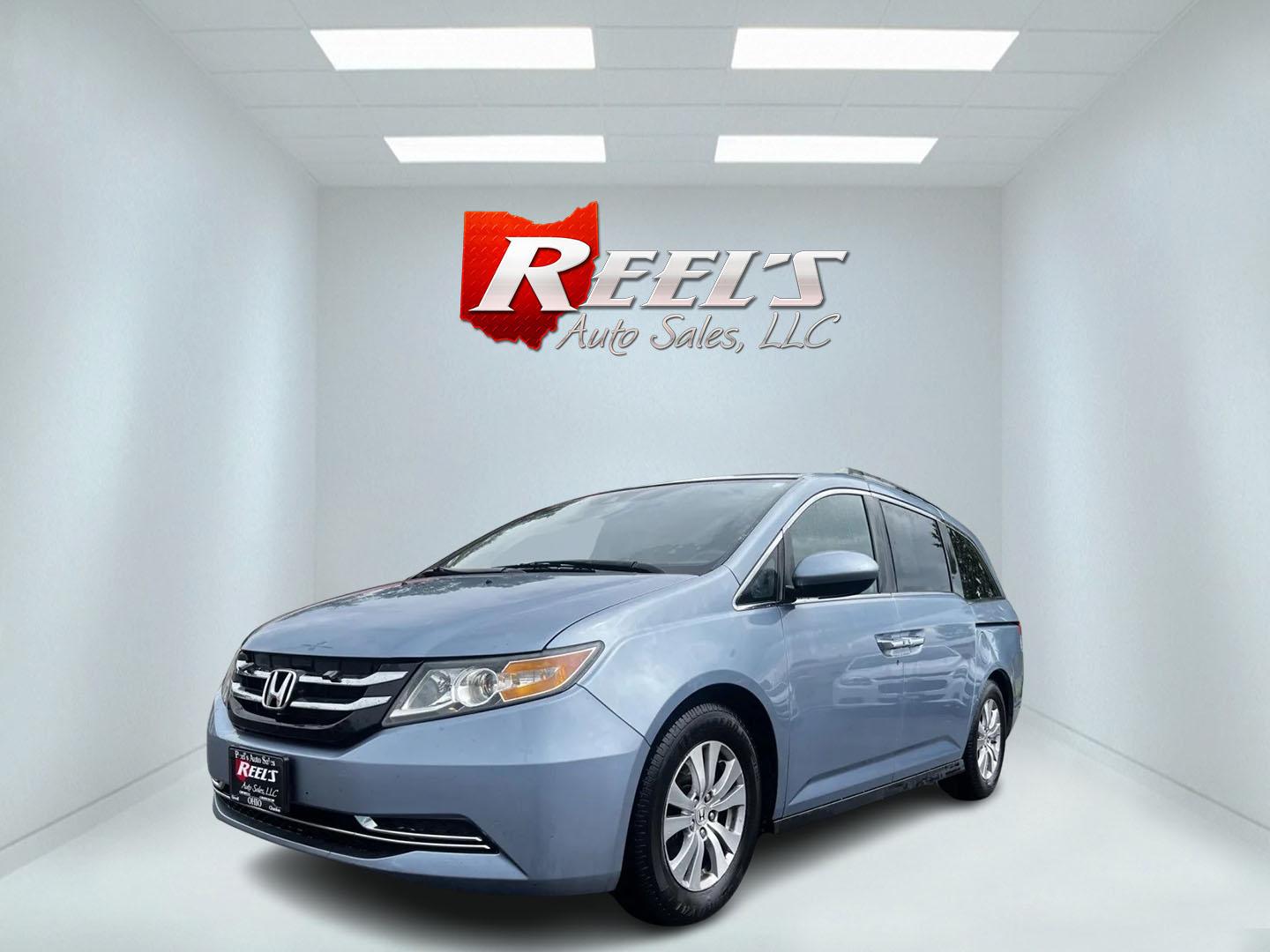 2014 Blue /Tan Honda Odyssey EX-L (5FNRL5H6XEB) with an 3.5L V6 SOHC 24V engine, 6-Speed Automatic transmission, located at 547 E. Main St., Orwell, OH, 44076, (440) 437-5893, 41.535435, -80.847855 - This 2014 Honda Odyssey EX-L is a well-equipped minivan featuring a powerful 3.5-liter SOHC V6 engine with VTEC technology, paired with a 6-speed automatic transmission. It offers a blend of comfort and safety features, including tri-zone automatic climate control, leather interior, heated and power - Photo#0