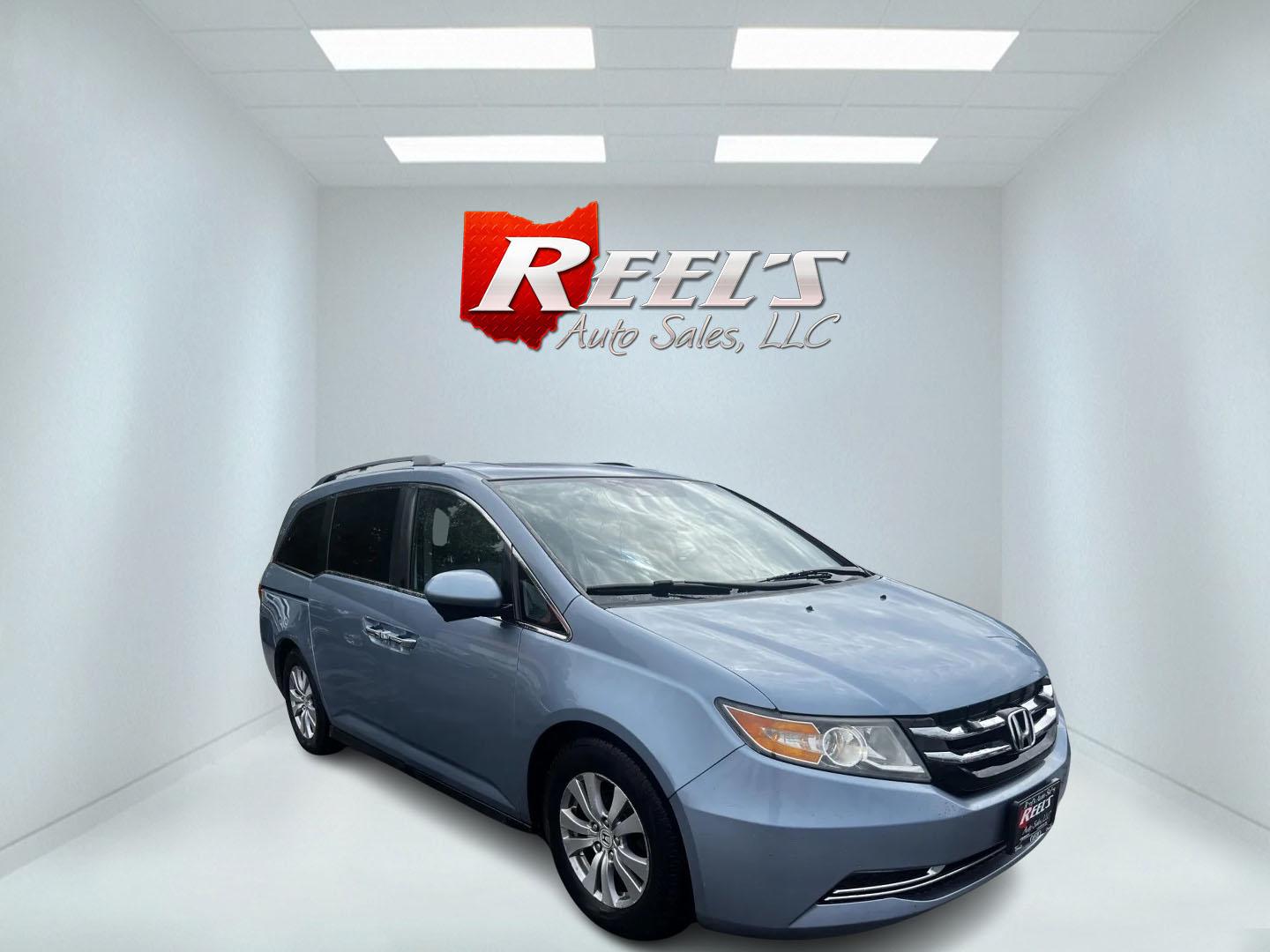 2014 Blue /Tan Honda Odyssey EX-L (5FNRL5H6XEB) with an 3.5L V6 SOHC 24V engine, 6-Speed Automatic transmission, located at 547 E. Main St., Orwell, OH, 44076, (440) 437-5893, 41.535435, -80.847855 - This 2014 Honda Odyssey EX-L is a well-equipped minivan featuring a powerful 3.5-liter SOHC V6 engine with VTEC technology, paired with a 6-speed automatic transmission. It offers a blend of comfort and safety features, including tri-zone automatic climate control, leather interior, heated and power - Photo#2