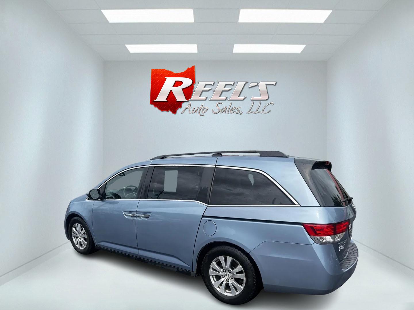 2014 Blue /Tan Honda Odyssey EX-L (5FNRL5H6XEB) with an 3.5L V6 SOHC 24V engine, 6-Speed Automatic transmission, located at 547 E. Main St., Orwell, OH, 44076, (440) 437-5893, 41.535435, -80.847855 - This 2014 Honda Odyssey EX-L is a well-equipped minivan featuring a powerful 3.5-liter SOHC V6 engine with VTEC technology, paired with a 6-speed automatic transmission. It offers a blend of comfort and safety features, including tri-zone automatic climate control, leather interior, heated and power - Photo#8