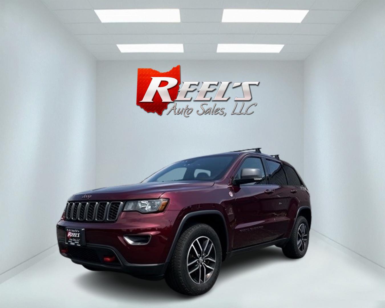 2017 Red /Black Jeep Grand Cherokee Trailhawk 4WD (1C4RJFLG4HC) with an 3.6L V6 DOHC 24V engine, 8A transmission, located at 11115 Chardon Rd. , Chardon, OH, 44024, (440) 214-9705, 41.580246, -81.241943 - This 2017 Jeep Grand Cherokee Trailhawk with a 3.6 Pentastar V6 engine and 8-speed automatic transmission is a well-equipped SUV designed for both rugged off-road performance and everyday comfort. Features like the Quadra Lift Air Suspension, 4WD system, and Electronic Limited Slip Rear Differential - Photo#0