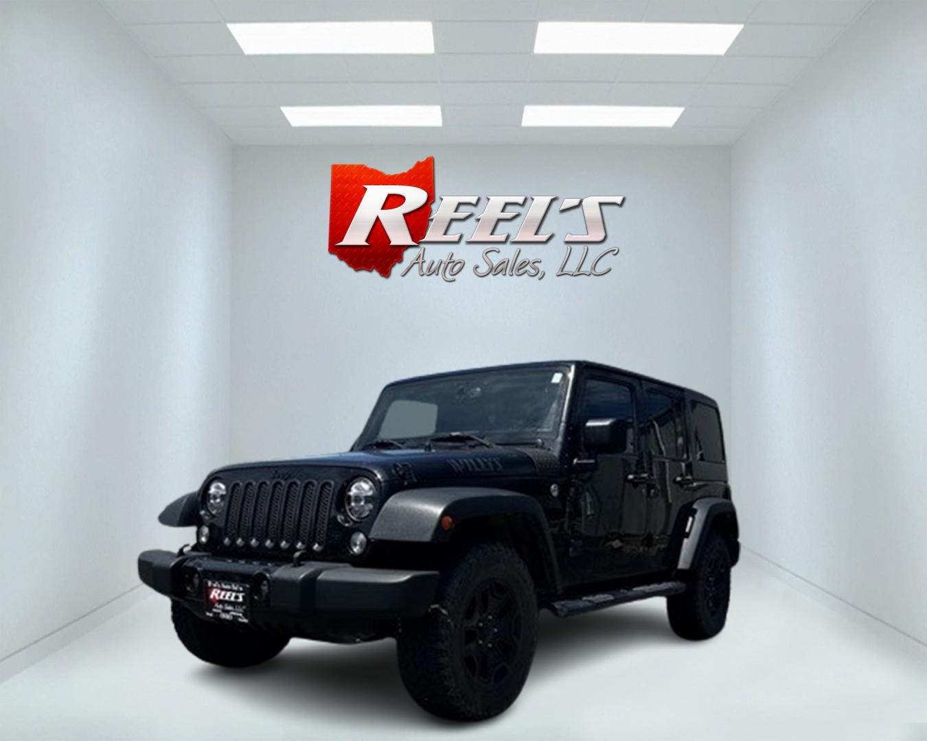 2015 Black /Black Jeep Wrangler Unlimited Willys 4WD (1C4BJWDG9FL) with an 3.6L V6 DOHC 24V engine, 6 Speed Manual transmission, located at 547 E. Main St., Orwell, OH, 44076, (440) 437-5893, 41.535435, -80.847855 - This 2015 Jeep Wrangler Unlimited Willy Wheeler Edition is a capable and well-equipped off-road vehicle. It features a 3.6-liter Pentastar V6 engine paired with a 6-speed manual transmission, offering a traditional driving experience favored by many off-road enthusiasts. The vehicle comes with sever - Photo#0