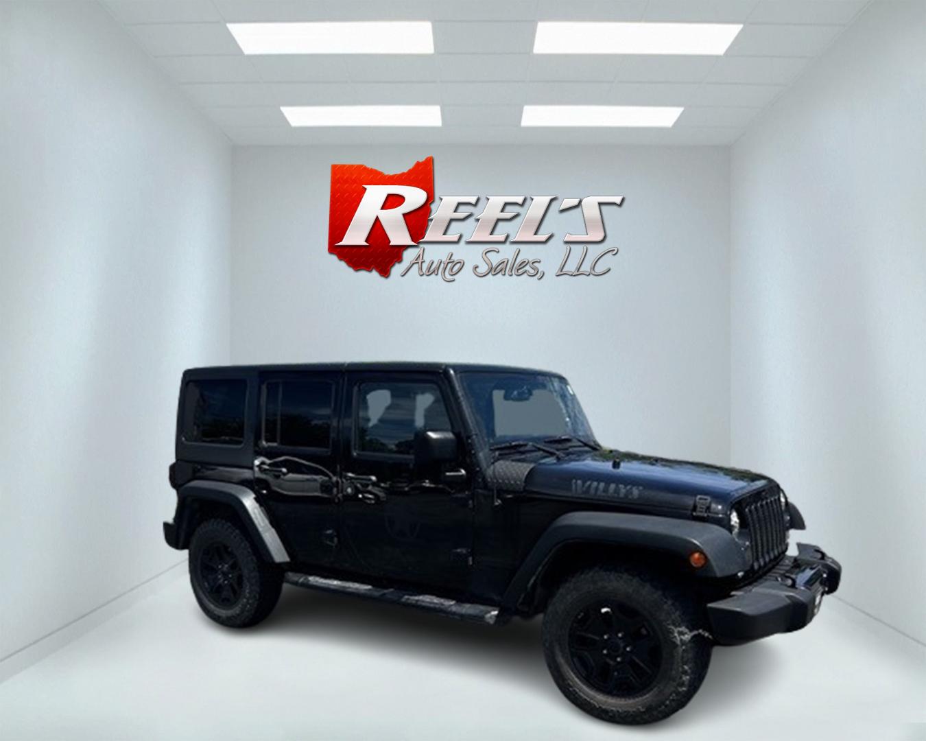 2015 Black /Black Jeep Wrangler Unlimited Willys 4WD (1C4BJWDG9FL) with an 3.6L V6 DOHC 24V engine, 6 Speed Manual transmission, located at 547 E. Main St., Orwell, OH, 44076, (440) 437-5893, 41.535435, -80.847855 - Photo#3