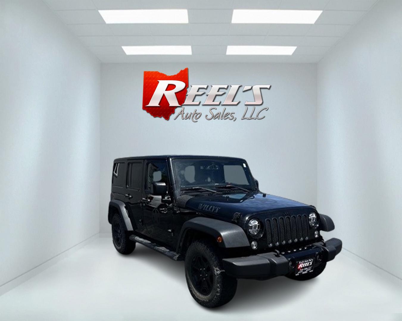 2015 Black /Black Jeep Wrangler Unlimited Willys 4WD (1C4BJWDG9FL) with an 3.6L V6 DOHC 24V engine, 6 Speed Manual transmission, located at 547 E. Main St., Orwell, OH, 44076, (440) 437-5893, 41.535435, -80.847855 - This 2015 Jeep Wrangler Unlimited Willy Wheeler Edition is a capable and well-equipped off-road vehicle. It features a 3.6-liter Pentastar V6 engine paired with a 6-speed manual transmission, offering a traditional driving experience favored by many off-road enthusiasts. The vehicle comes with sever - Photo#2