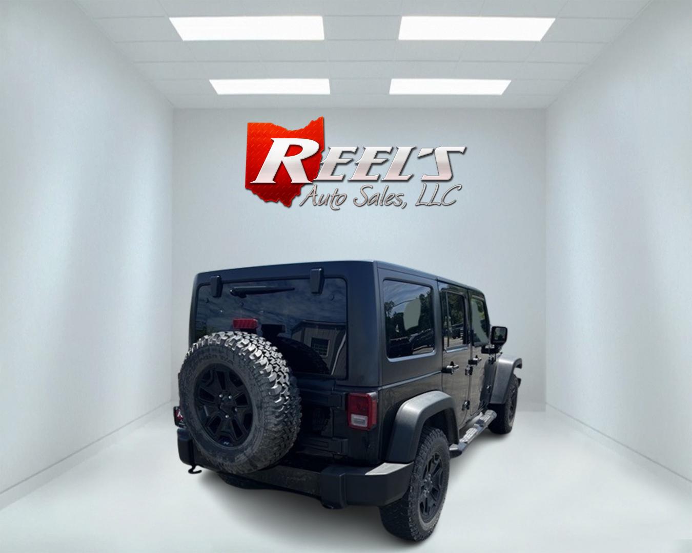 2015 Black /Black Jeep Wrangler Unlimited Willys 4WD (1C4BJWDG9FL) with an 3.6L V6 DOHC 24V engine, 6 Speed Manual transmission, located at 547 E. Main St., Orwell, OH, 44076, (440) 437-5893, 41.535435, -80.847855 - Photo#5