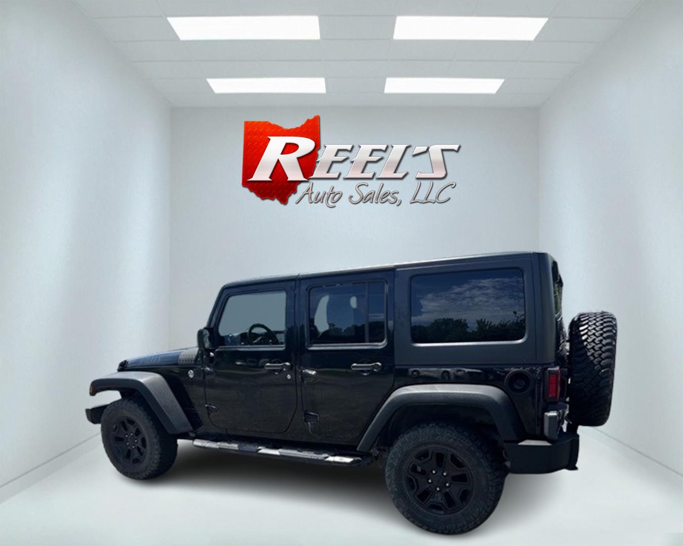 2015 Black /Black Jeep Wrangler Unlimited Willys 4WD (1C4BJWDG9FL) with an 3.6L V6 DOHC 24V engine, 6 Speed Manual transmission, located at 547 E. Main St., Orwell, OH, 44076, (440) 437-5893, 41.535435, -80.847855 - This 2015 Jeep Wrangler Unlimited Willy Wheeler Edition is a capable and well-equipped off-road vehicle. It features a 3.6-liter Pentastar V6 engine paired with a 6-speed manual transmission, offering a traditional driving experience favored by many off-road enthusiasts. The vehicle comes with sever - Photo#8