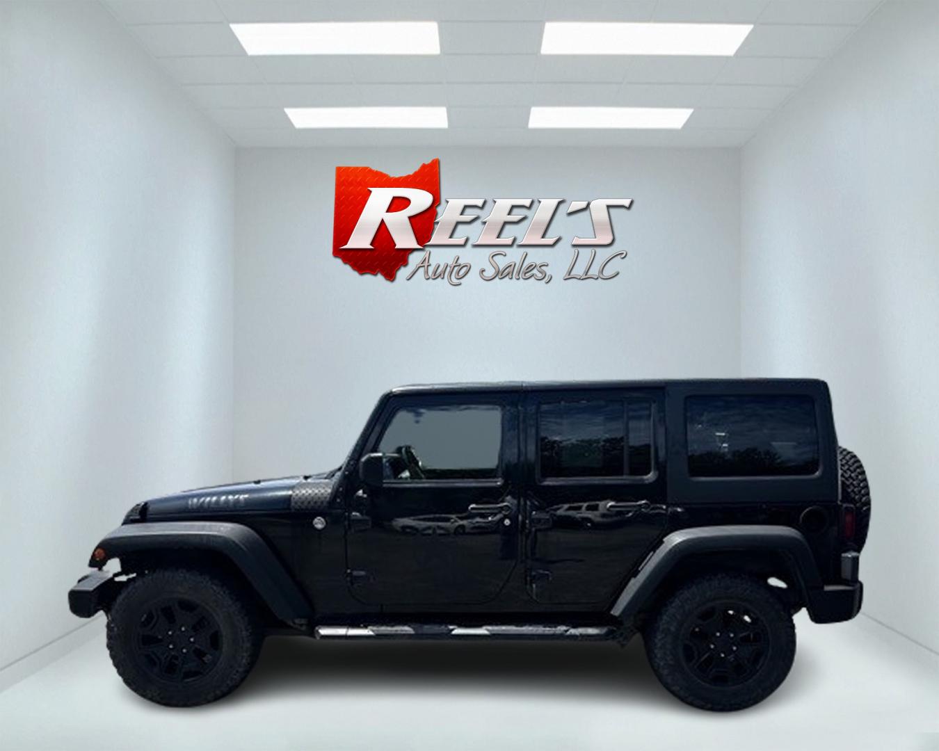 2015 Black /Black Jeep Wrangler Unlimited Willys 4WD (1C4BJWDG9FL) with an 3.6L V6 DOHC 24V engine, 6 Speed Manual transmission, located at 547 E. Main St., Orwell, OH, 44076, (440) 437-5893, 41.535435, -80.847855 - Photo#9