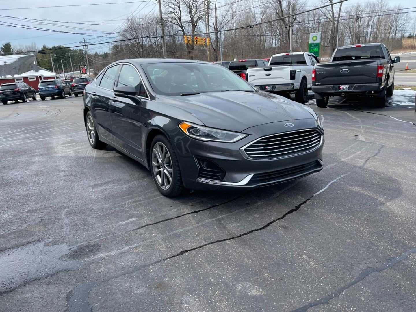 2019 Gray /Black Ford Fusion SEL (3FA6P0CD5KR) with an 1.5L I4 DOHC 16V TURBO engine, 6A transmission, located at 547 E. Main St., Orwell, OH, 44076, (440) 437-5893, 41.535435, -80.847855 - Photo#2