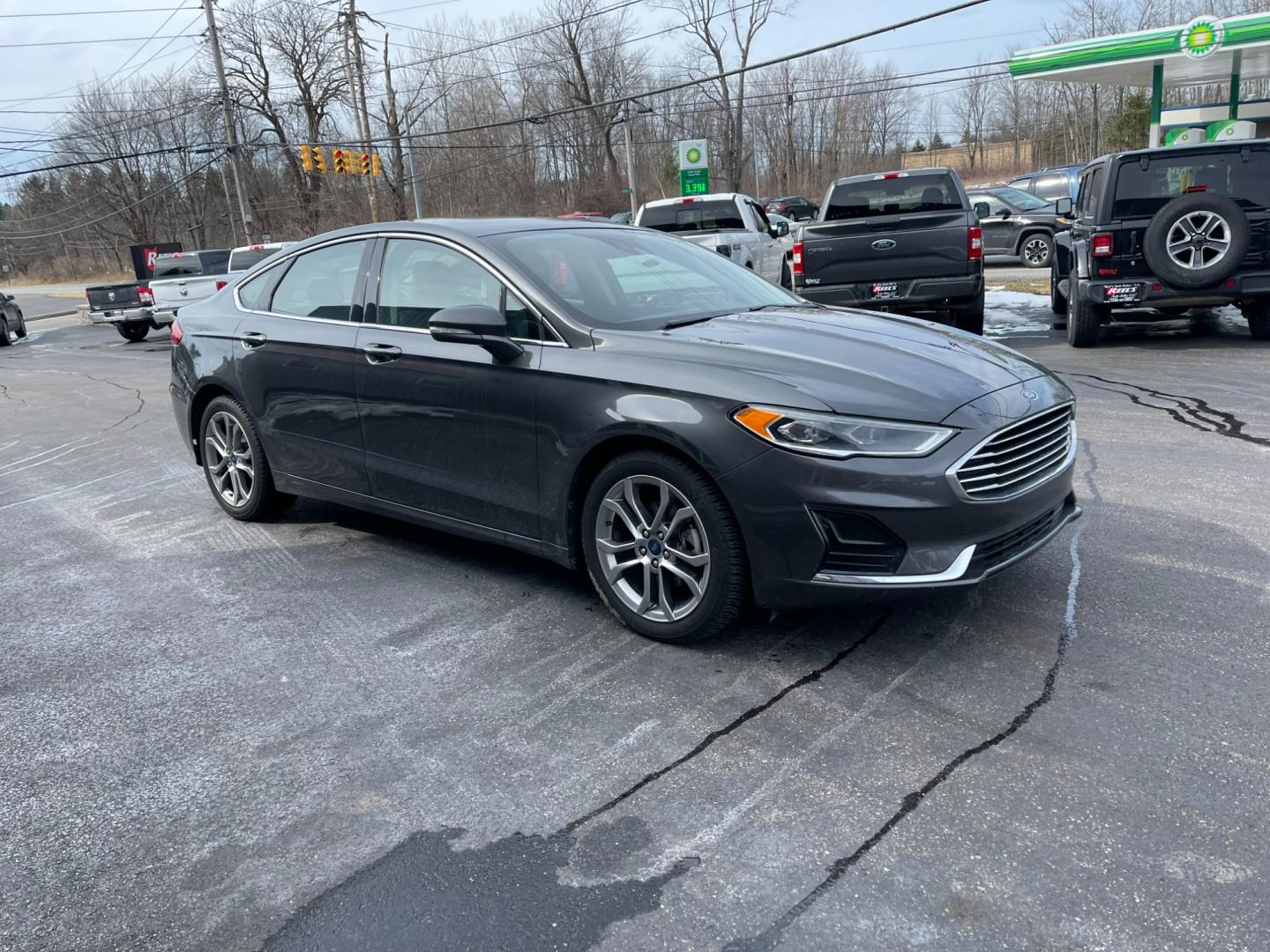 2019 Gray /Black Ford Fusion SEL (3FA6P0CD5KR) with an 1.5L I4 DOHC 16V TURBO engine, 6A transmission, located at 547 E. Main St., Orwell, OH, 44076, (440) 437-5893, 41.535435, -80.847855 - Photo#3