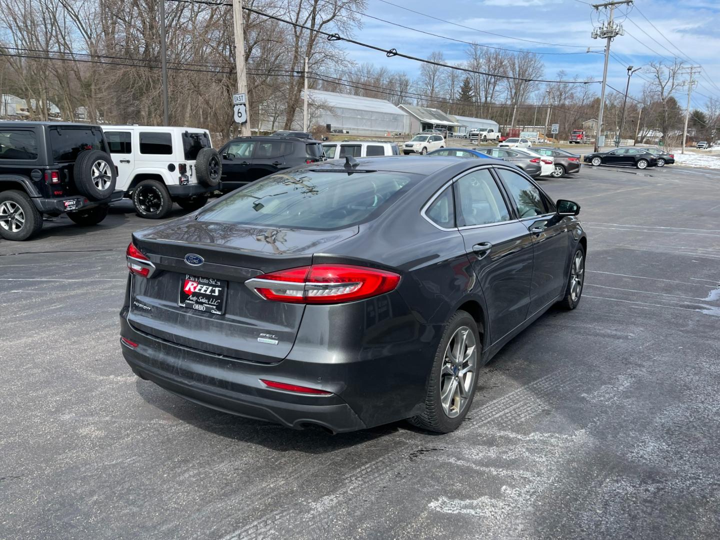 2019 Gray /Black Ford Fusion SEL (3FA6P0CD5KR) with an 1.5L I4 DOHC 16V TURBO engine, 6A transmission, located at 547 E. Main St., Orwell, OH, 44076, (440) 437-5893, 41.535435, -80.847855 - Photo#7