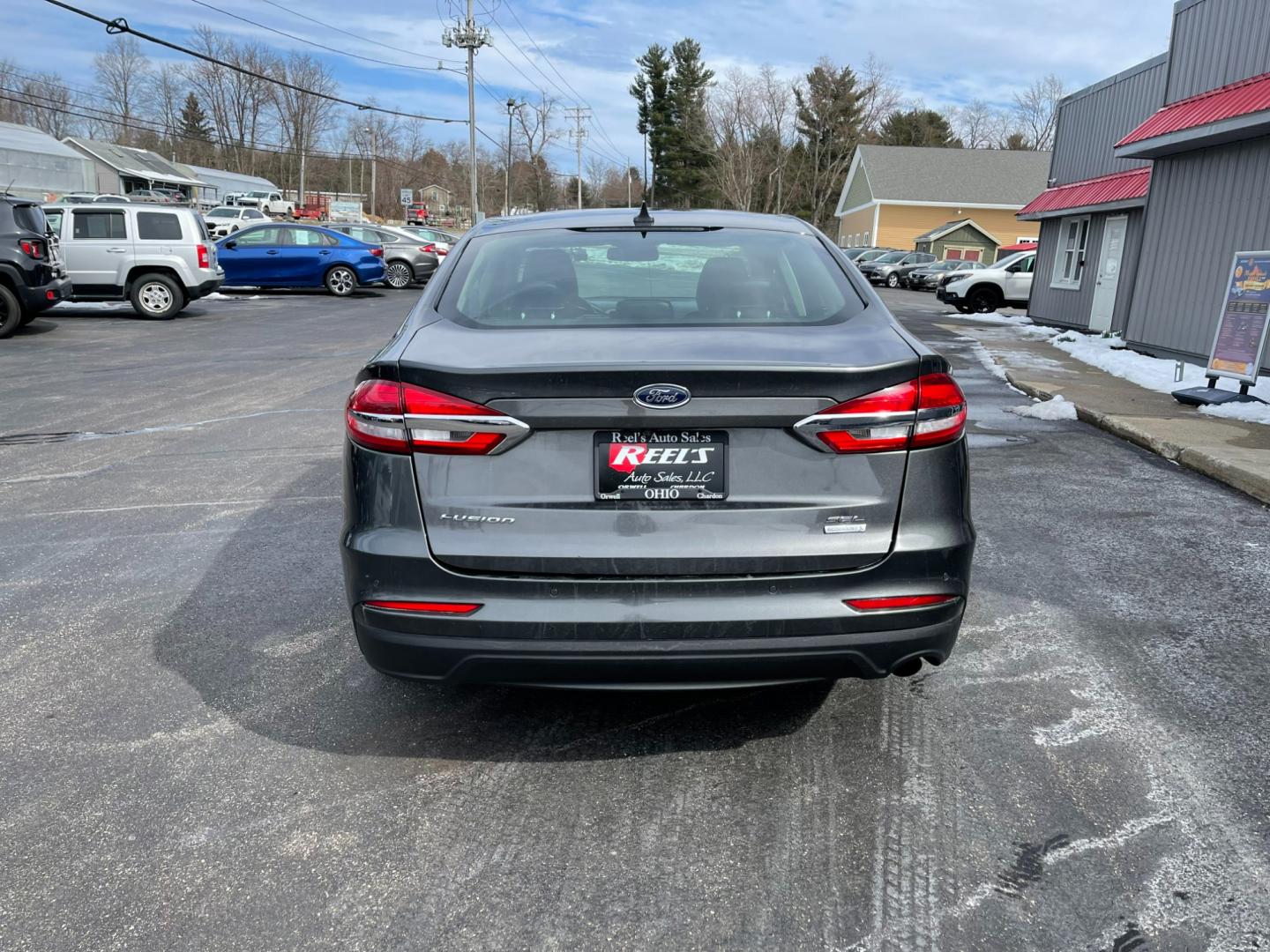 2019 Gray /Black Ford Fusion SEL (3FA6P0CD5KR) with an 1.5L I4 DOHC 16V TURBO engine, 6A transmission, located at 547 E. Main St., Orwell, OH, 44076, (440) 437-5893, 41.535435, -80.847855 - Photo#8