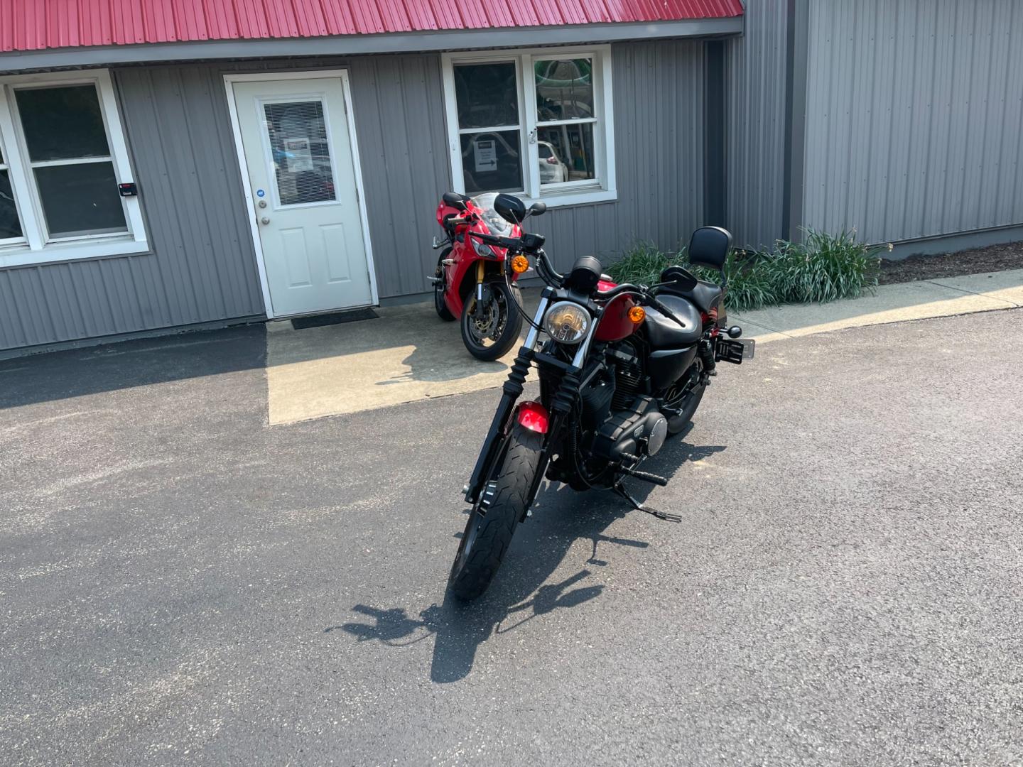 2012 Red /Black Harley-Davidson XL883N XL 883 (1HD4LE214CC) with an 883 CC Twin V engine, 5 Speed Manual transmission, located at 11115 Chardon Rd. , Chardon, OH, 44024, (440) 214-9705, 41.580246, -81.241943 - Photo#0