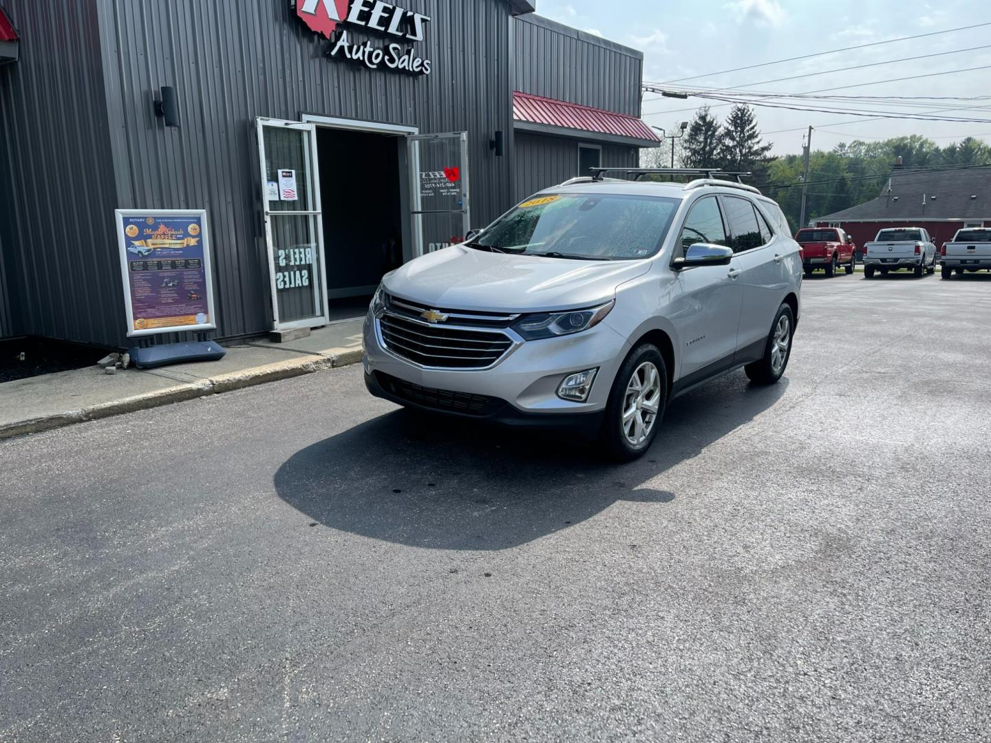 2018 Silver /Black Chevrolet Equinox Premier AWD (2GNAXVEV1J6) with an 1.5L I4 DIR DOHC 16V TURBO engine, 6A transmission, located at 11115 Chardon Rd. , Chardon, OH, 44024, (440) 214-9705, 41.580246, -81.241943 - Photo#0