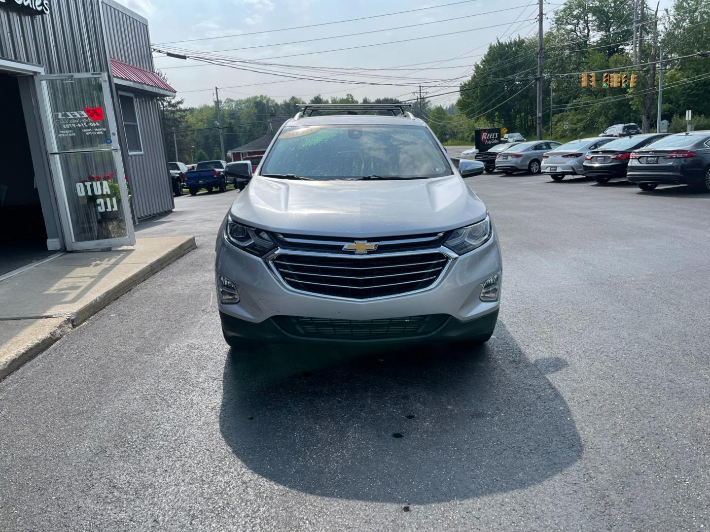 2018 Silver /Black Chevrolet Equinox Premier AWD (2GNAXVEV1J6) with an 1.5L I4 DIR DOHC 16V TURBO engine, 6A transmission, located at 11115 Chardon Rd. , Chardon, OH, 44024, (440) 214-9705, 41.580246, -81.241943 - Photo#1