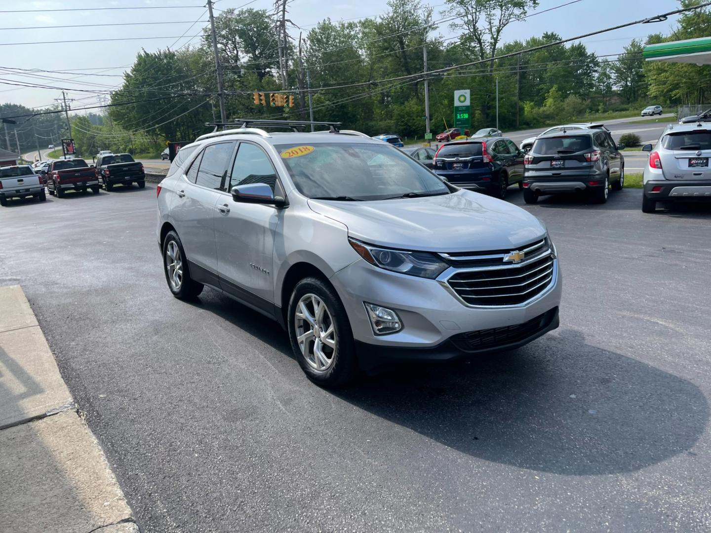 2018 Silver /Black Chevrolet Equinox Premier AWD (2GNAXVEV1J6) with an 1.5L I4 DIR DOHC 16V TURBO engine, 6A transmission, located at 11115 Chardon Rd. , Chardon, OH, 44024, (440) 214-9705, 41.580246, -81.241943 - Photo#2