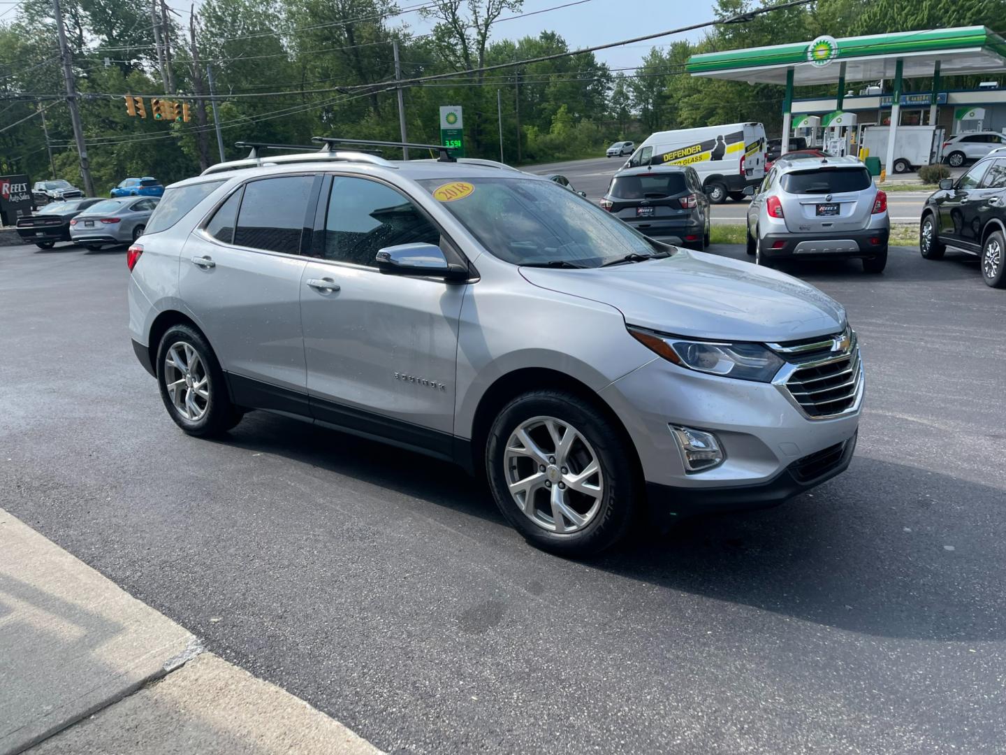 2018 Silver /Black Chevrolet Equinox Premier AWD (2GNAXVEV1J6) with an 1.5L I4 DIR DOHC 16V TURBO engine, 6A transmission, located at 11115 Chardon Rd. , Chardon, OH, 44024, (440) 214-9705, 41.580246, -81.241943 - Photo#3