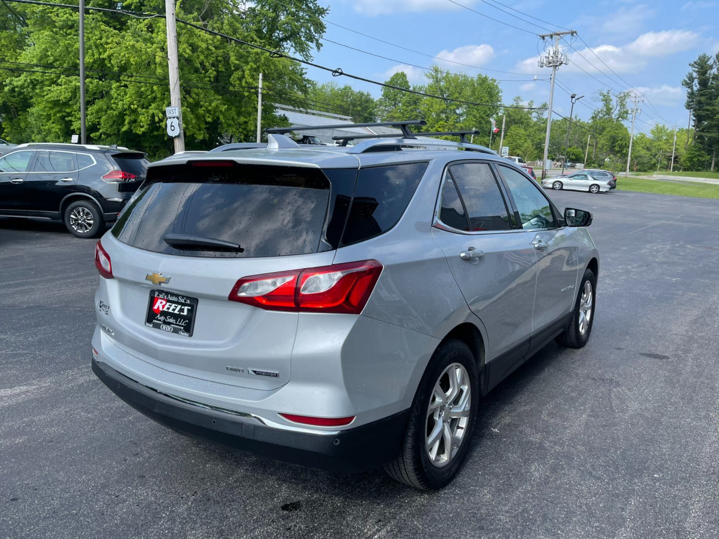 2018 Silver /Black Chevrolet Equinox Premier AWD (2GNAXVEV1J6) with an 1.5L I4 DIR DOHC 16V TURBO engine, 6A transmission, located at 11115 Chardon Rd. , Chardon, OH, 44024, (440) 214-9705, 41.580246, -81.241943 - Photo#7