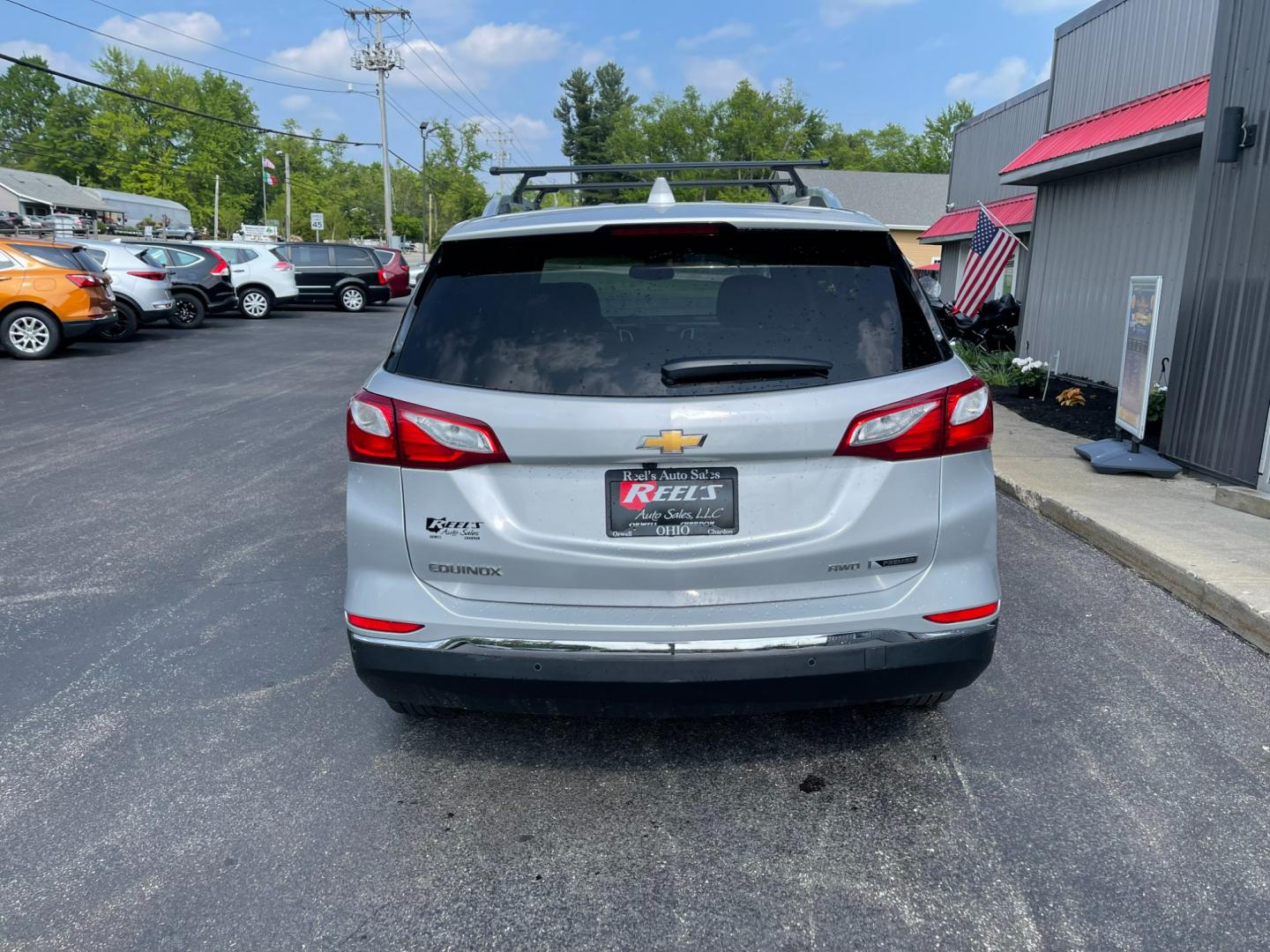 2018 Silver /Black Chevrolet Equinox Premier AWD (2GNAXVEV1J6) with an 1.5L I4 DIR DOHC 16V TURBO engine, 6A transmission, located at 11115 Chardon Rd. , Chardon, OH, 44024, (440) 214-9705, 41.580246, -81.241943 - Photo#8