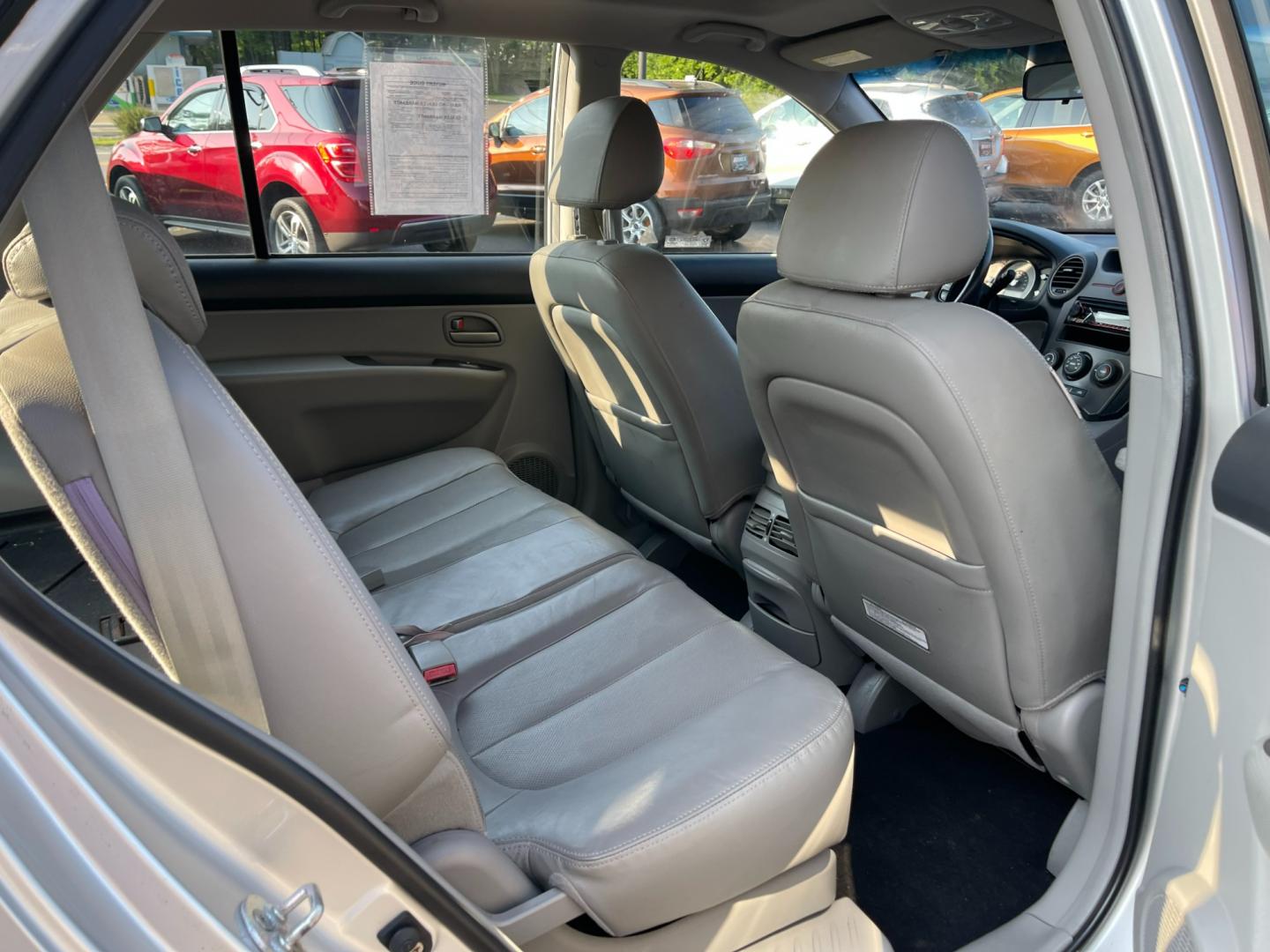 2007 Silver /Black Kia Rondo EX V6 (KNAFG526277) with an 2.7L V6 DOHC 24V engine, 5-Speed Automatic Overdrive transmission, located at 11115 Chardon Rd. , Chardon, OH, 44024, (440) 214-9705, 41.580246, -81.241943 - Photo#36