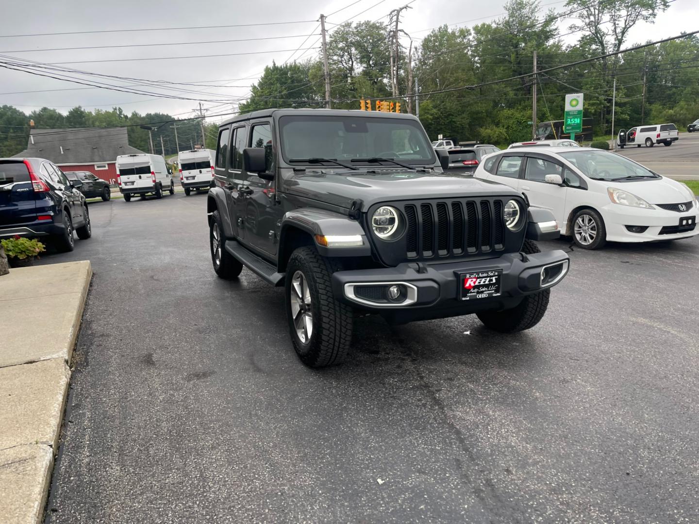 2019 Gray /Black Jeep Wrangler Unlimited Sahara (1C4HJXEG1KW) with an 3.6L V6 DOHC 24V engine, 8A transmission, located at 11115 Chardon Rd. , Chardon, OH, 44024, (440) 214-9705, 41.580246, -81.241943 - Photo#2