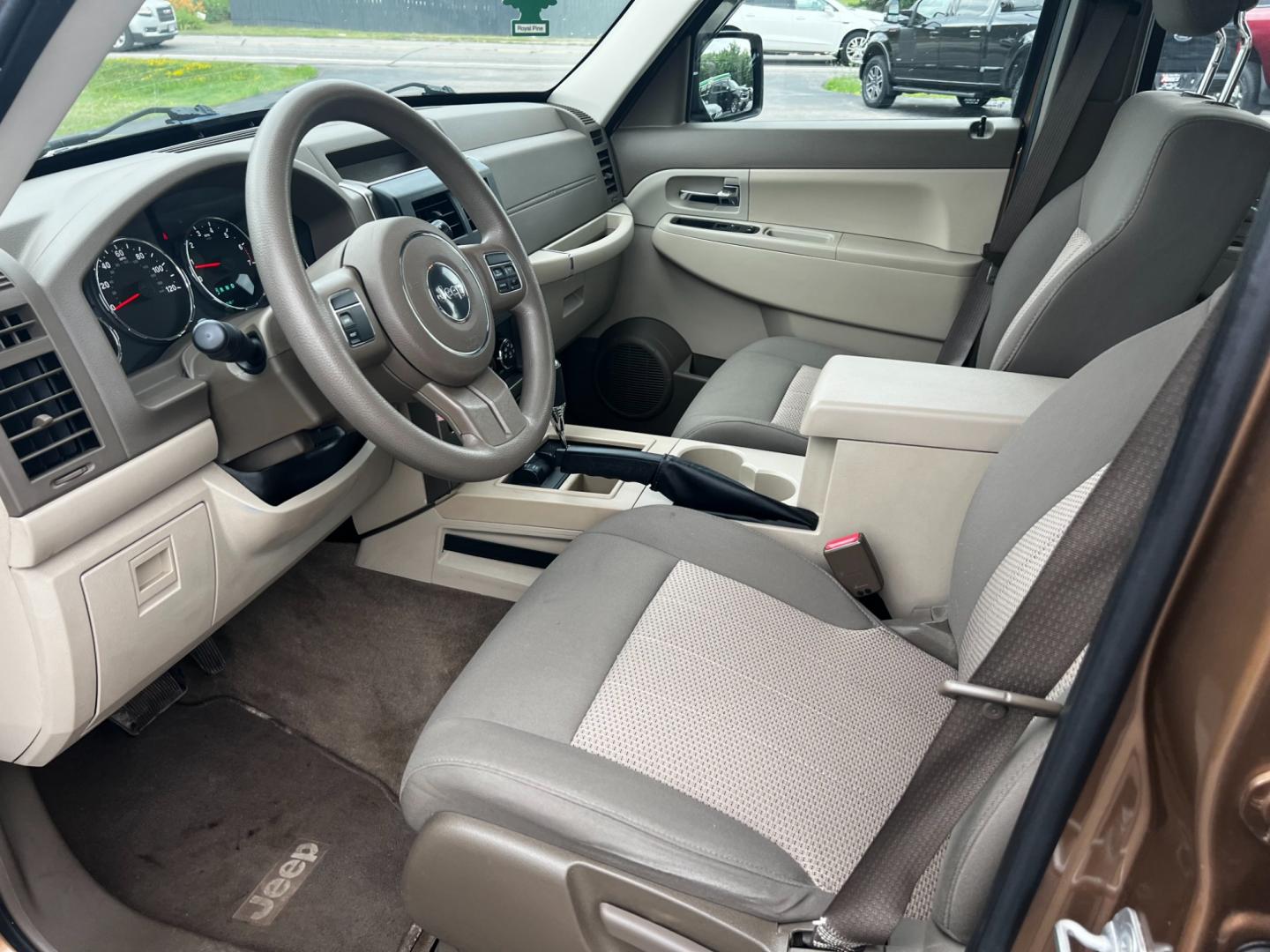 2012 Brown /Gray Jeep Liberty Sport 4WD (1C4PJMAK4CW) with an 3.7L V6 SOHC 12V engine, 4-Speed Automatic transmission, located at 547 E. Main St., Orwell, OH, 44076, (440) 437-5893, 41.535435, -80.847855 - This 2012 Jeep Liberty Sport is a reliable and capable off-road vehicle, featuring a 3.7-liter SOHC V6 engine and a 4-speed automatic transmission. With Trail Rated capability, it can handle tough terrain and inclement weather conditions. The dusk-sensing headlights adjust to changing light conditio - Photo#23