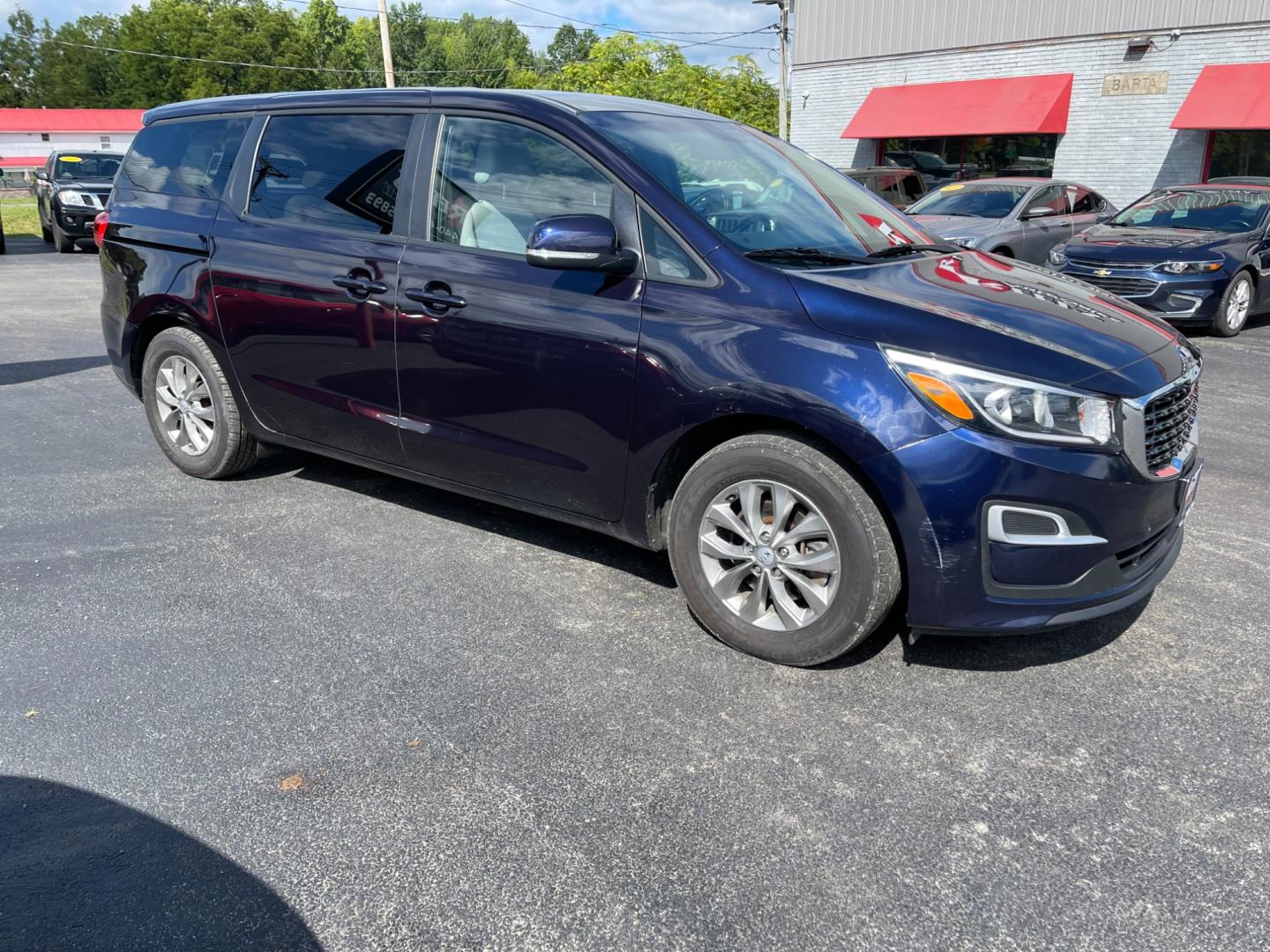 2020 Blue /Tan Kia Sedona LX (KNDMB5C12L6) with an 3.3L V6 DOHC 24V engine, 8-Speed Automatic transmission, located at 547 E. Main St., Orwell, OH, 44076, (440) 437-5893, 41.535435, -80.847855 - Photo#4