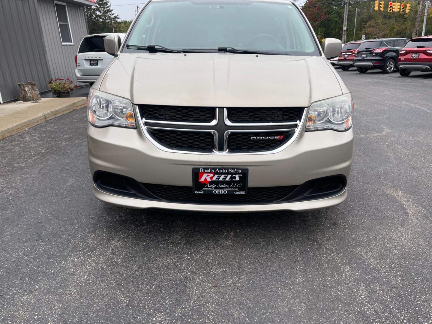 2012 Gold /Black Dodge Grand Caravan SXT (2C4RDGCG7CR) with an 3.6L V6 DOHC 24V engine, 6-Speed Automatic transmission, located at 547 E. Main St., Orwell, OH, 44076, (440) 437-5893, 41.535435, -80.847855 - Photo#1