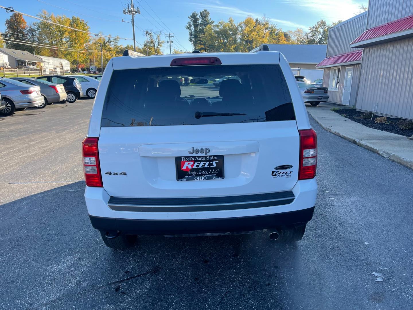 2016 White /Black Jeep Patriot Sport SE 4WD (1C4NJRBB8GD) with an 2.4L I4 DOHC 16V engine, 6-Speed Automatic transmission, located at 11115 Chardon Rd. , Chardon, OH, 44024, (440) 214-9705, 41.580246, -81.241943 - Photo#9