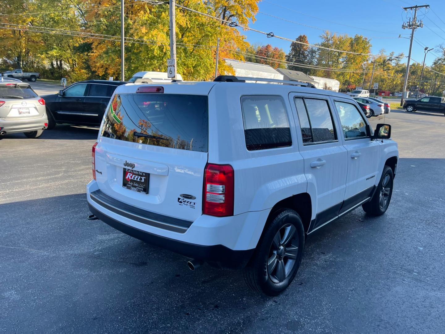 2016 White /Black Jeep Patriot Sport SE 4WD (1C4NJRBB8GD) with an 2.4L I4 DOHC 16V engine, 6-Speed Automatic transmission, located at 11115 Chardon Rd. , Chardon, OH, 44024, (440) 214-9705, 41.580246, -81.241943 - Photo#8