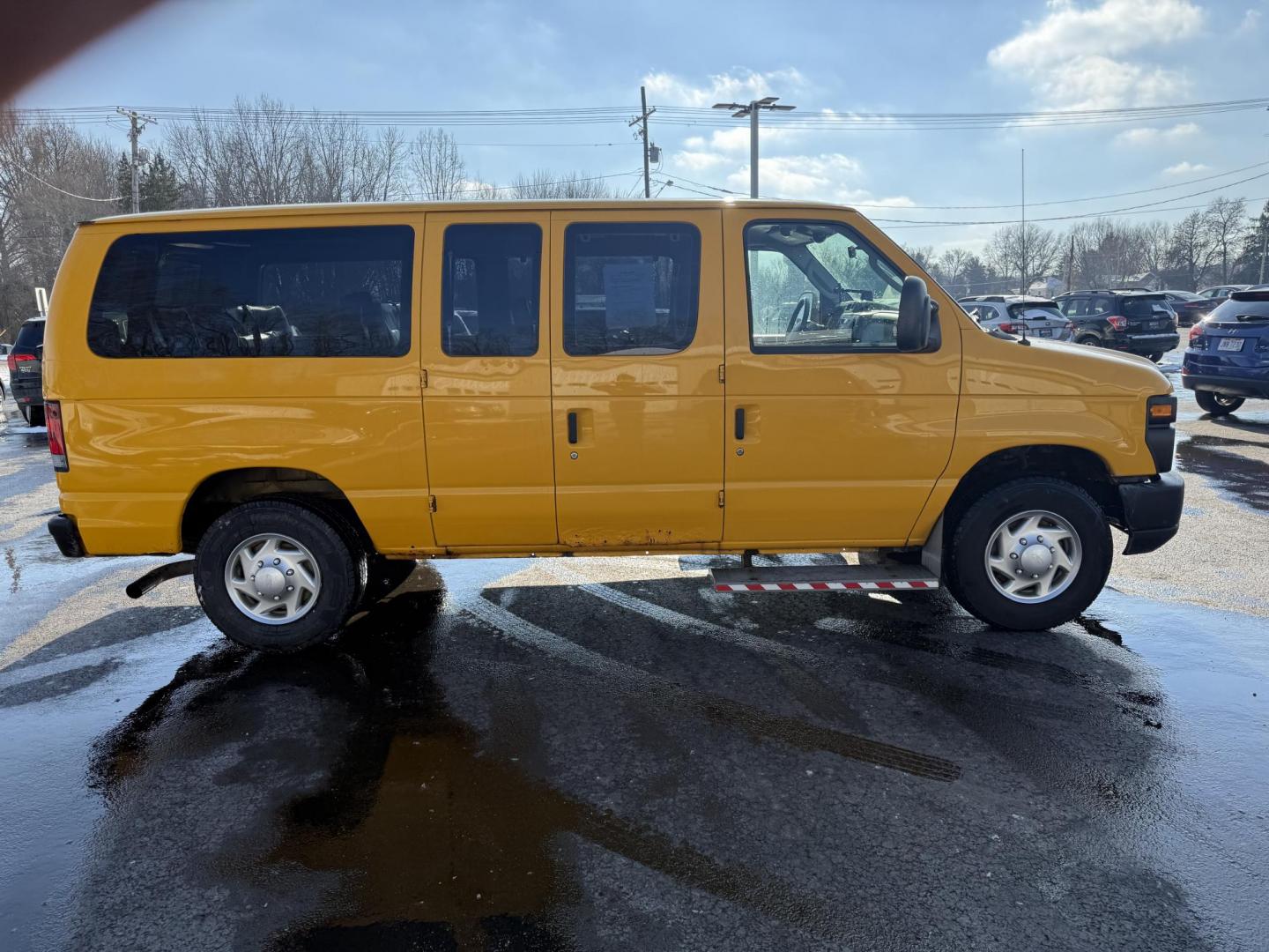 2012 Yellow /Gray Ford E-Series Van E-250 (1FTNE2ELXCD) with an 5.4L V8 SOHC 16V FFV engine, 4-Speed Automatic transmission, located at 11115 Chardon Rd. , Chardon, OH, 44024, (440) 214-9705, 41.580246, -81.241943 - This Fresh Trade 2012 Ford E-250 Passenger Van is a robust vehicle ideal for large group transportation and towing needs. Equipped with a 5.4-liter Triton V8 engine and a 4-speed automatic transmission, it is capable of handling demanding tasks with ease. This van is flex-fuel capable, allowing it t - Photo#16