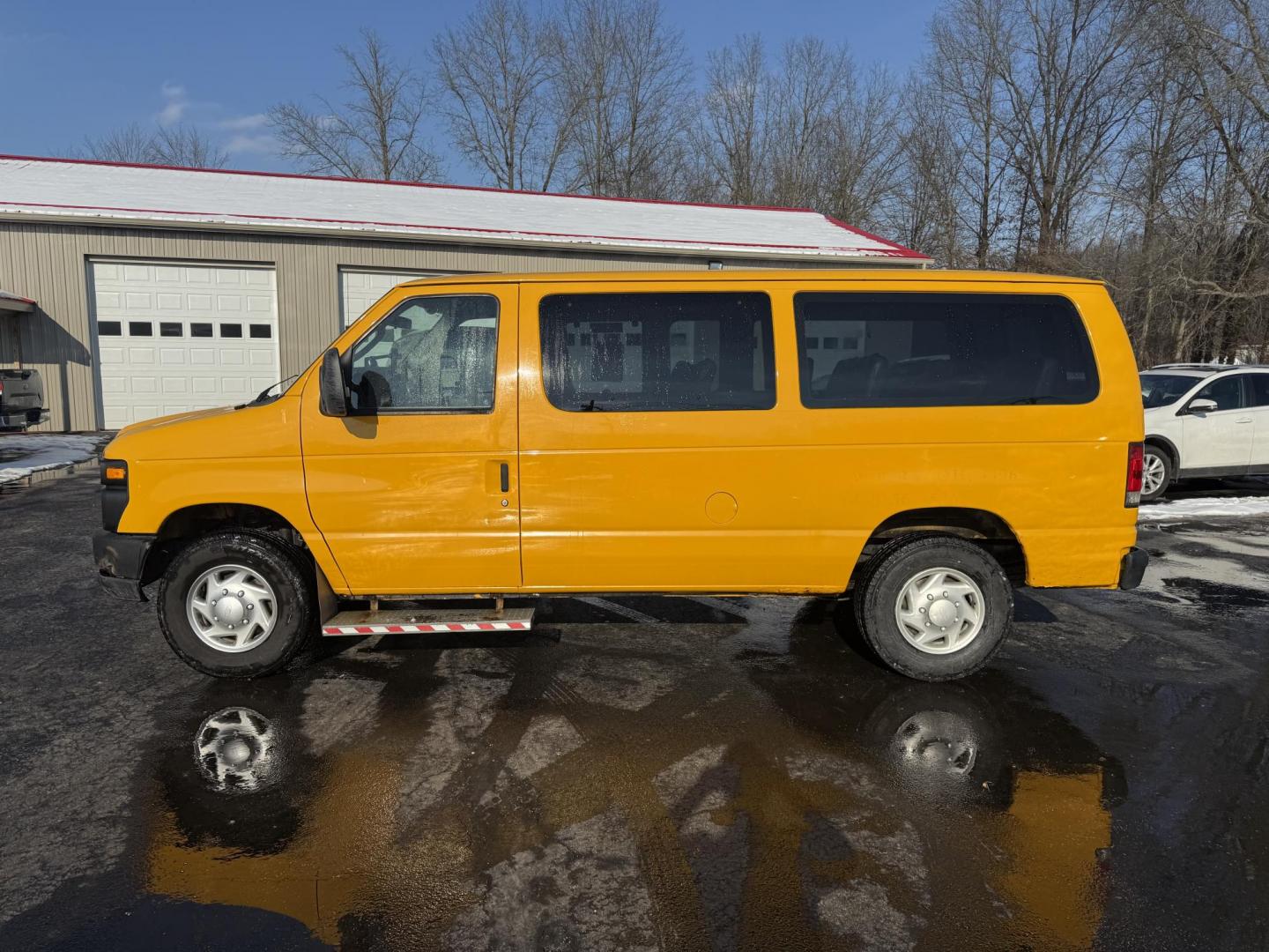 2012 Yellow /Gray Ford E-Series Van E-250 (1FTNE2ELXCD) with an 5.4L V8 SOHC 16V FFV engine, 4-Speed Automatic transmission, located at 11115 Chardon Rd. , Chardon, OH, 44024, (440) 214-9705, 41.580246, -81.241943 - This Fresh Trade 2012 Ford E-250 Passenger Van is a robust vehicle ideal for large group transportation and towing needs. Equipped with a 5.4-liter Triton V8 engine and a 4-speed automatic transmission, it is capable of handling demanding tasks with ease. This van is flex-fuel capable, allowing it t - Photo#21