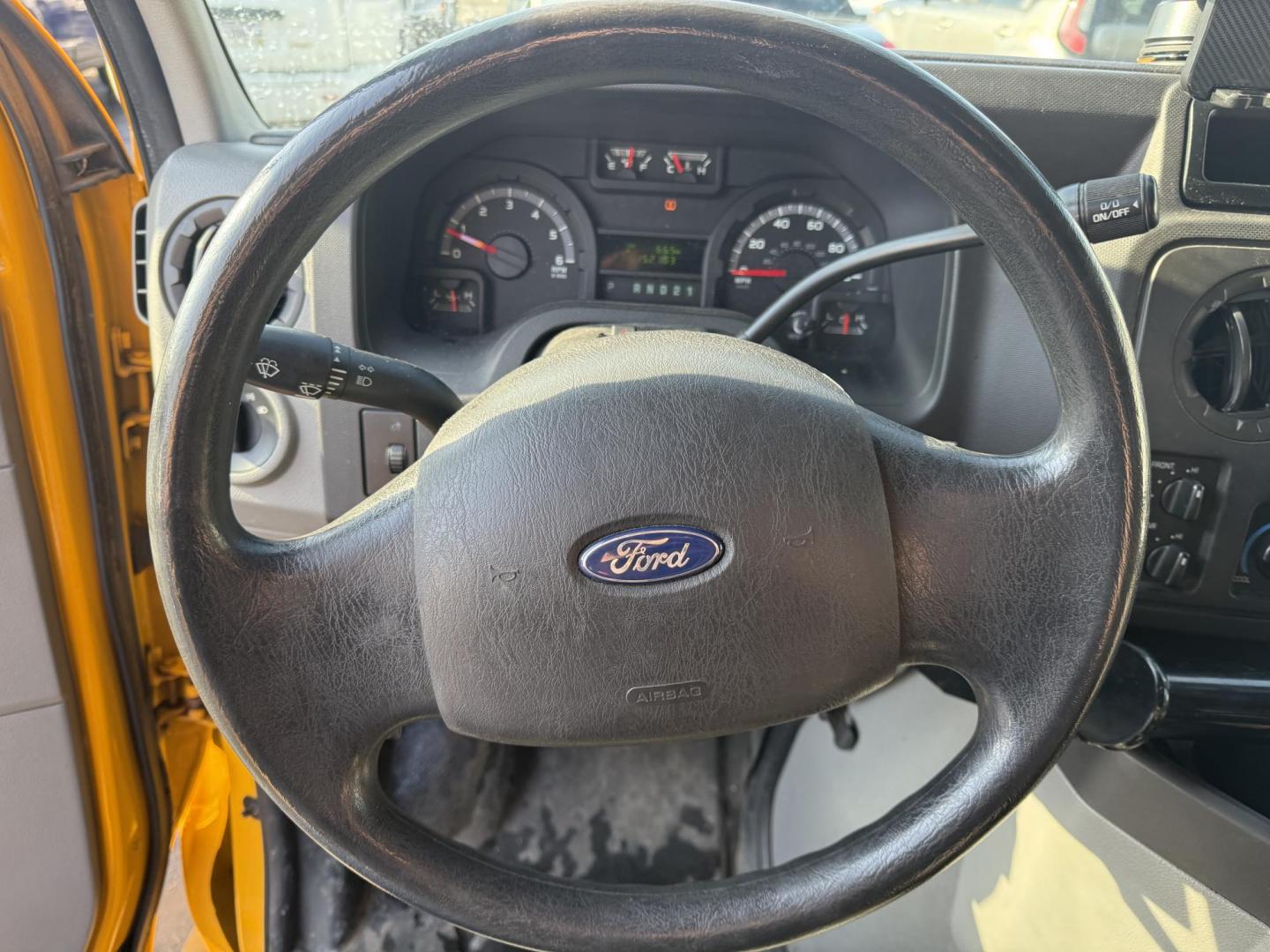 2012 Yellow /Gray Ford E-Series Van E-250 (1FTNE2ELXCD) with an 5.4L V8 SOHC 16V FFV engine, 4-Speed Automatic transmission, located at 11115 Chardon Rd. , Chardon, OH, 44024, (440) 214-9705, 41.580246, -81.241943 - This Fresh Trade 2012 Ford E-250 Passenger Van is a robust vehicle ideal for large group transportation and towing needs. Equipped with a 5.4-liter Triton V8 engine and a 4-speed automatic transmission, it is capable of handling demanding tasks with ease. This van is flex-fuel capable, allowing it t - Photo#6