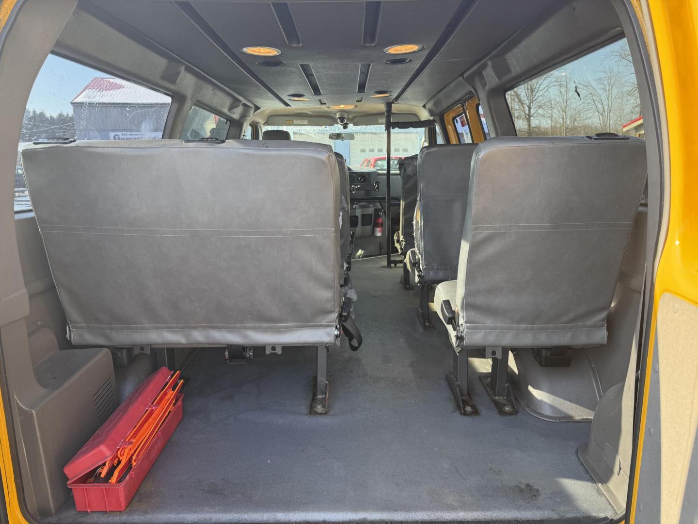 2012 Yellow /Gray Ford E-Series Van E-250 (1FTNE2ELXCD) with an 5.4L V8 SOHC 16V FFV engine, 4-Speed Automatic transmission, located at 11115 Chardon Rd. , Chardon, OH, 44024, (440) 214-9705, 41.580246, -81.241943 - This Fresh Trade 2012 Ford E-250 Passenger Van is a robust vehicle ideal for large group transportation and towing needs. Equipped with a 5.4-liter Triton V8 engine and a 4-speed automatic transmission, it is capable of handling demanding tasks with ease. This van is flex-fuel capable, allowing it t - Photo#24