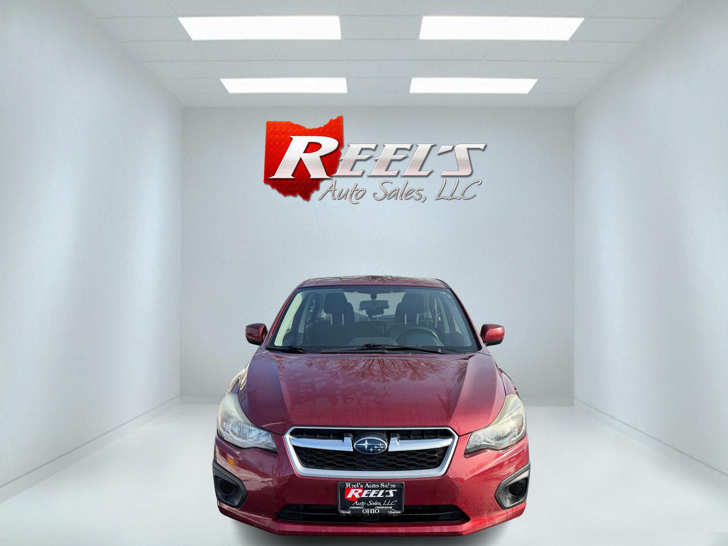 2013 Red /Black Subaru Impreza Premium (JF1GJAD60DH) with an 2.0L H4 DOHC 16V engine, Automatic transmission, located at 547 E. Main St., Orwell, OH, 44076, (440) 437-5893, 41.535435, -80.847855 - This 2013 Subaru Impreza Premium offers a robust combination of performance and efficiency, powered by a 2.0L H4 engine paired with Subaru's renowned Symmetrical All-Wheel Drive (AWD) system, providing excellent traction and stability across various driving conditions. This model achieves an impress - Photo#1