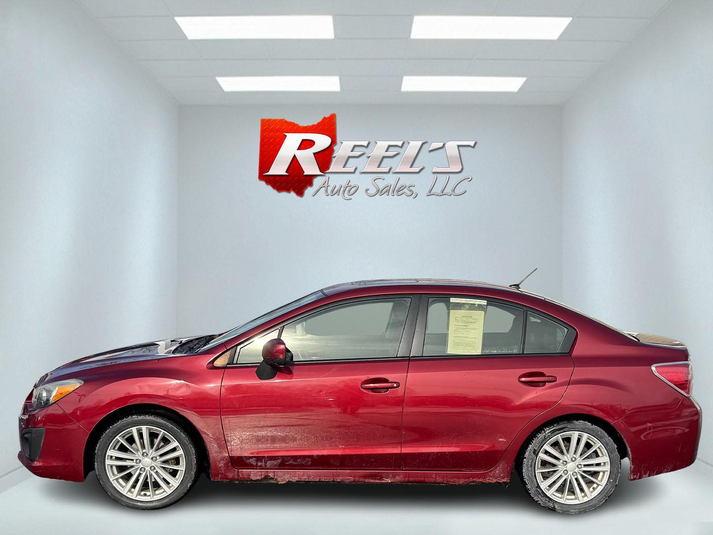 2013 Red /Black Subaru Impreza Premium (JF1GJAD60DH) with an 2.0L H4 DOHC 16V engine, Automatic transmission, located at 547 E. Main St., Orwell, OH, 44076, (440) 437-5893, 41.535435, -80.847855 - This 2013 Subaru Impreza Premium offers a robust combination of performance and efficiency, powered by a 2.0L H4 engine paired with Subaru's renowned Symmetrical All-Wheel Drive (AWD) system, providing excellent traction and stability across various driving conditions. This model achieves an impress - Photo#26