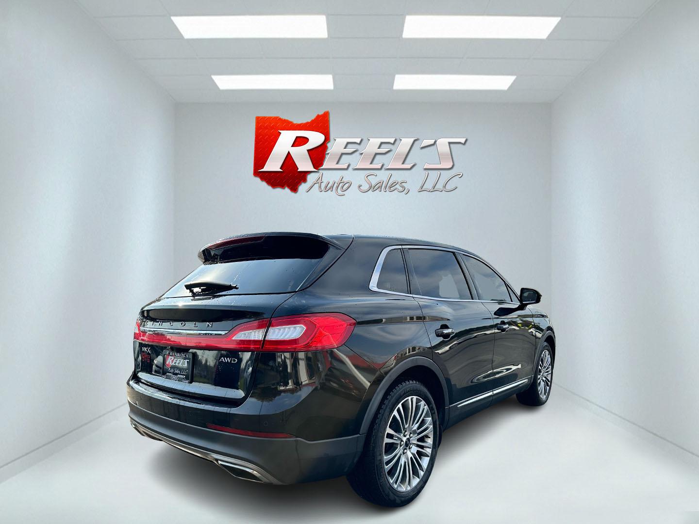 2016 Black /Black Lincoln MKX Reserve AWD (2LMTJ8LR7GB) with an 3.7L V6 DOHC 24V engine, 6-Speed Automatic transmission, located at 547 E. Main St., Orwell, OH, 44076, (440) 437-5893, 41.535435, -80.847855 - This 2016 Lincoln MKX Reserve AWD is a luxurious mid-size SUV equipped with a 3.7-liter V6 engine and a 6-speed automatic transmission, offering a wealth of comfort and safety features. Inside, passengers are treated to heated and cooled front seats, leather interior, and heated rear seats, ensuring - Photo#5