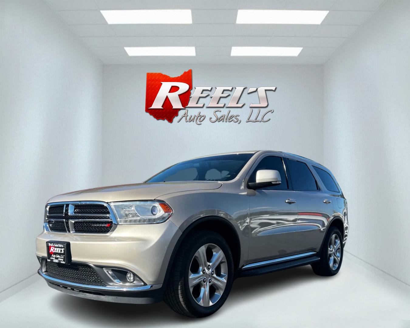 2014 Gold /Tan Dodge Durango Limited AWD (1C4RDJDG8EC) with an 3.6L V6 DOHC 24V engine, 8-Speed Automatic transmission, located at 547 E. Main St., Orwell, OH, 44076, (440) 437-5893, 41.535435, -80.847855 - Photo#0