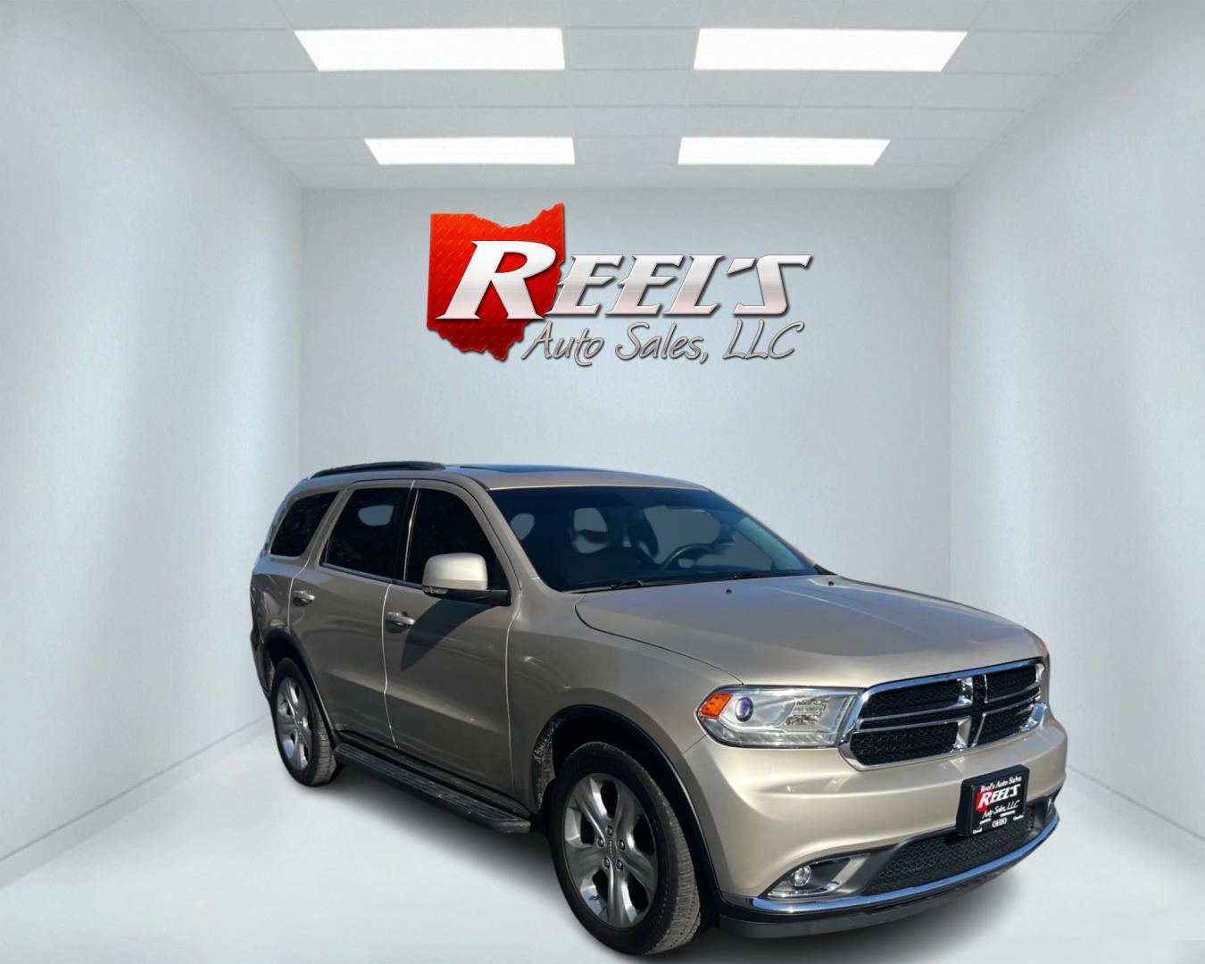 2014 Gold /Tan Dodge Durango Limited AWD (1C4RDJDG8EC) with an 3.6L V6 DOHC 24V engine, 8-Speed Automatic transmission, located at 547 E. Main St., Orwell, OH, 44076, (440) 437-5893, 41.535435, -80.847855 - Photo#2