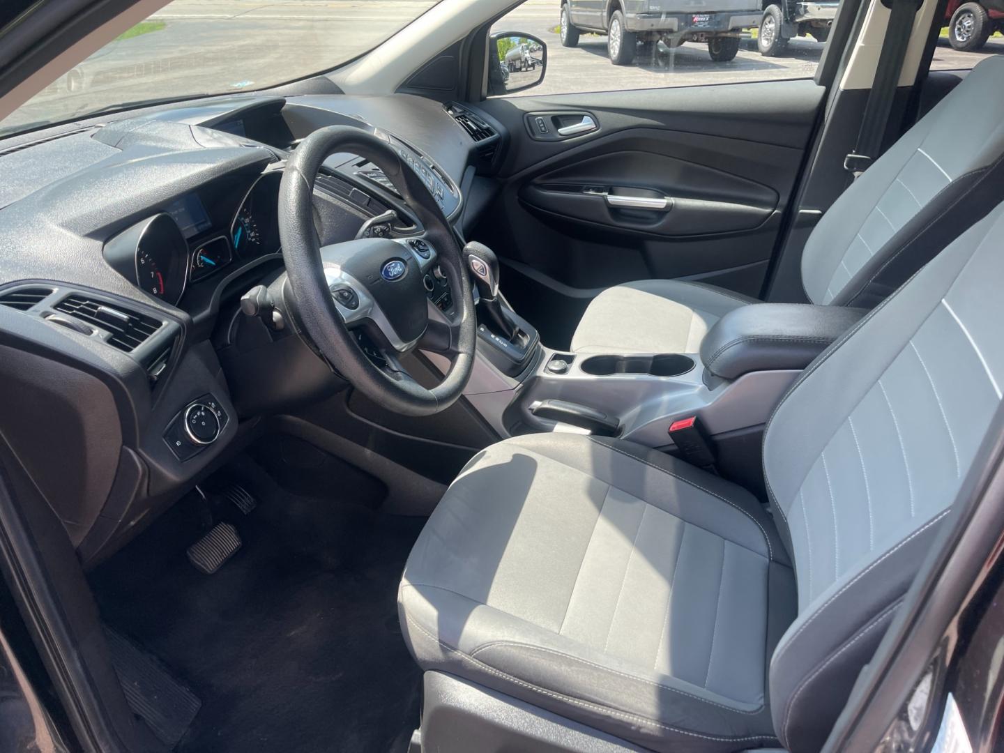 2015 Black /Black Ford Escape SE 4WD (1FMCU9GX4FU) with an 1.6L I4 DOHC 16V TURBO engine, 6-Speed Automatic transmission, located at 11115 Chardon Rd. , Chardon, OH, 44024, (440) 214-9705, 41.580246, -81.241943 - This 2015 Ford Escape SE 4WD, equipped with a 1.6L I4 Turbocharged EcoBoost engine and a 6-speed automatic transmission, offers a compelling blend of performance and efficiency. Key features include daytime running lights, dusk-sensing headlights, a power driver's seat, and a backup camera, with an - Photo#17