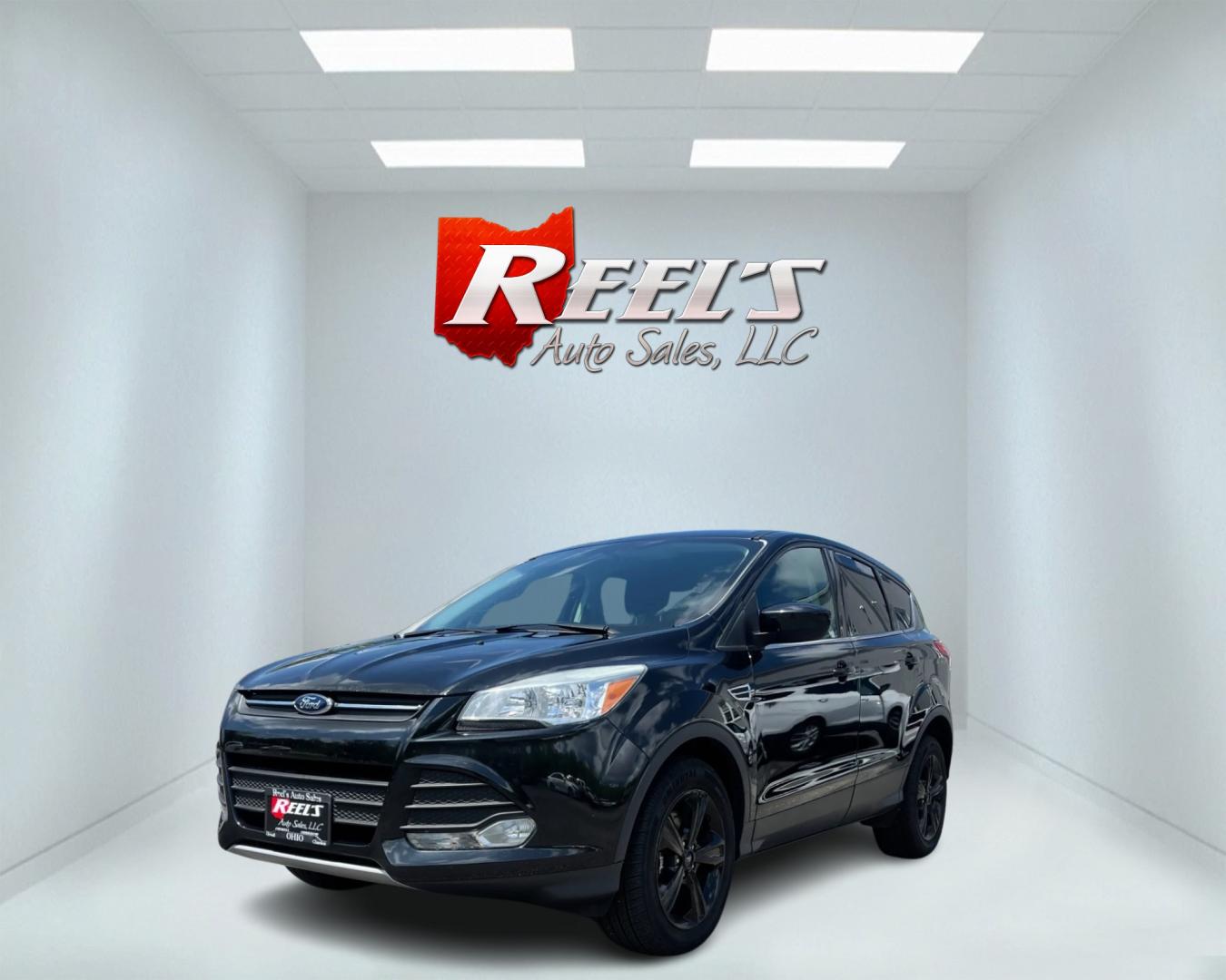 2015 Black /Black Ford Escape SE 4WD (1FMCU9GX4FU) with an 1.6L I4 DOHC 16V TURBO engine, 6-Speed Automatic transmission, located at 11115 Chardon Rd. , Chardon, OH, 44024, (440) 214-9705, 41.580246, -81.241943 - This 2015 Ford Escape SE 4WD, equipped with a 1.6L I4 Turbocharged EcoBoost engine and a 6-speed automatic transmission, offers a compelling blend of performance and efficiency. Key features include daytime running lights, dusk-sensing headlights, a power driver's seat, and a backup camera, with an - Photo#0