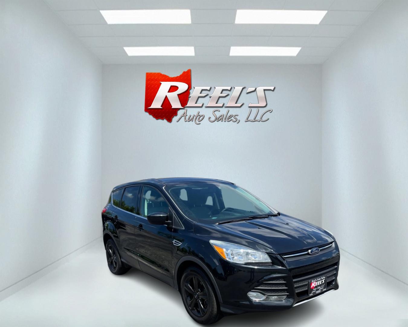 2015 Black /Black Ford Escape SE 4WD (1FMCU9GX4FU) with an 1.6L I4 DOHC 16V TURBO engine, 6-Speed Automatic transmission, located at 11115 Chardon Rd. , Chardon, OH, 44024, (440) 214-9705, 41.580246, -81.241943 - This 2015 Ford Escape SE 4WD, equipped with a 1.6L I4 Turbocharged EcoBoost engine and a 6-speed automatic transmission, offers a compelling blend of performance and efficiency. Key features include daytime running lights, dusk-sensing headlights, a power driver's seat, and a backup camera, with an - Photo#2