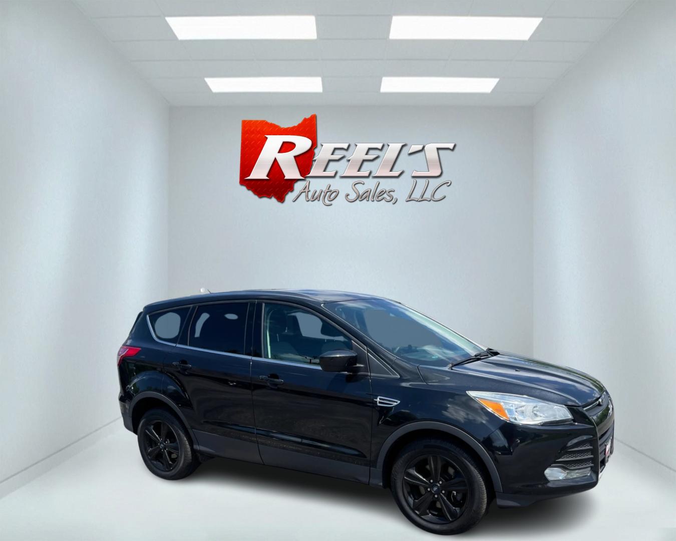 2015 Black /Black Ford Escape SE 4WD (1FMCU9GX4FU) with an 1.6L I4 DOHC 16V TURBO engine, 6-Speed Automatic transmission, located at 11115 Chardon Rd. , Chardon, OH, 44024, (440) 214-9705, 41.580246, -81.241943 - This 2015 Ford Escape SE 4WD, equipped with a 1.6L I4 Turbocharged EcoBoost engine and a 6-speed automatic transmission, offers a compelling blend of performance and efficiency. Key features include daytime running lights, dusk-sensing headlights, a power driver's seat, and a backup camera, with an - Photo#3