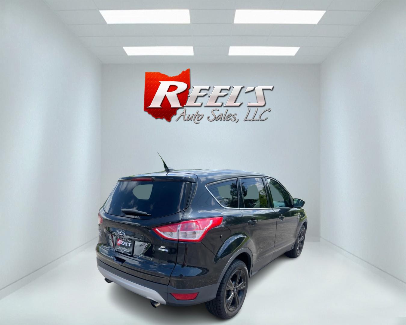 2015 Black /Black Ford Escape SE 4WD (1FMCU9GX4FU) with an 1.6L I4 DOHC 16V TURBO engine, 6-Speed Automatic transmission, located at 11115 Chardon Rd. , Chardon, OH, 44024, (440) 214-9705, 41.580246, -81.241943 - This 2015 Ford Escape SE 4WD, equipped with a 1.6L I4 Turbocharged EcoBoost engine and a 6-speed automatic transmission, offers a compelling blend of performance and efficiency. Key features include daytime running lights, dusk-sensing headlights, a power driver's seat, and a backup camera, with an - Photo#5