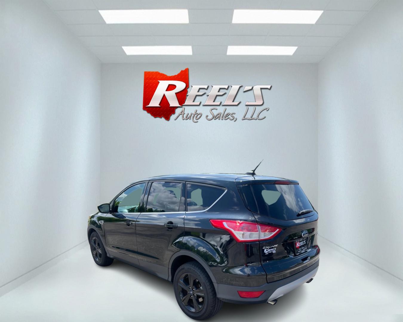 2015 Black /Black Ford Escape SE 4WD (1FMCU9GX4FU) with an 1.6L I4 DOHC 16V TURBO engine, 6-Speed Automatic transmission, located at 11115 Chardon Rd. , Chardon, OH, 44024, (440) 214-9705, 41.580246, -81.241943 - This 2015 Ford Escape SE 4WD, equipped with a 1.6L I4 Turbocharged EcoBoost engine and a 6-speed automatic transmission, offers a compelling blend of performance and efficiency. Key features include daytime running lights, dusk-sensing headlights, a power driver's seat, and a backup camera, with an - Photo#7