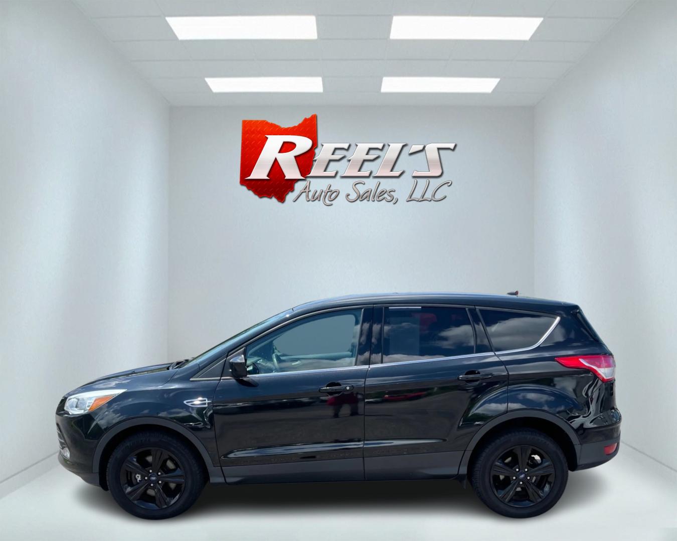 2015 Black /Black Ford Escape SE 4WD (1FMCU9GX4FU) with an 1.6L I4 DOHC 16V TURBO engine, 6-Speed Automatic transmission, located at 11115 Chardon Rd. , Chardon, OH, 44024, (440) 214-9705, 41.580246, -81.241943 - This 2015 Ford Escape SE 4WD, equipped with a 1.6L I4 Turbocharged EcoBoost engine and a 6-speed automatic transmission, offers a compelling blend of performance and efficiency. Key features include daytime running lights, dusk-sensing headlights, a power driver's seat, and a backup camera, with an - Photo#9