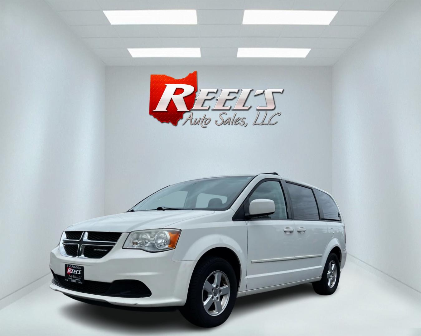 2011 White /Black Dodge Grand Caravan Mainstreet (2D4RN3DG9BR) with an 3.6L V6 DOHC 24V FFV engine, 6-Speed Automatic transmission, located at 547 E. Main St., Orwell, OH, 44076, (440) 437-5893, 41.535435, -80.847855 - This 2011 Dodge Grand Caravan Mainstreet offers a robust 3.6 Pentastar V6 engine paired with a 6-speed automatic transmission, providing a blend of power and efficiency, including flex-fuel capability. The minivan prioritizes convenience and comfort with features such as a power driver's seat, power - Photo#0