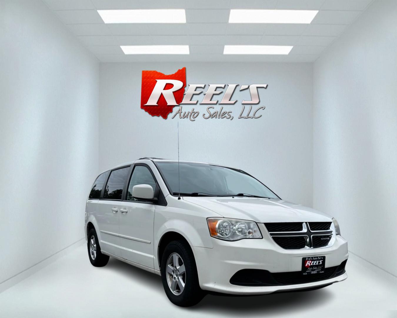 2011 White /Black Dodge Grand Caravan Mainstreet (2D4RN3DG9BR) with an 3.6L V6 DOHC 24V FFV engine, 6-Speed Automatic transmission, located at 547 E. Main St., Orwell, OH, 44076, (440) 437-5893, 41.535435, -80.847855 - This 2011 Dodge Grand Caravan Mainstreet offers a robust 3.6 Pentastar V6 engine paired with a 6-speed automatic transmission, providing a blend of power and efficiency, including flex-fuel capability. The minivan prioritizes convenience and comfort with features such as a power driver's seat, power - Photo#2