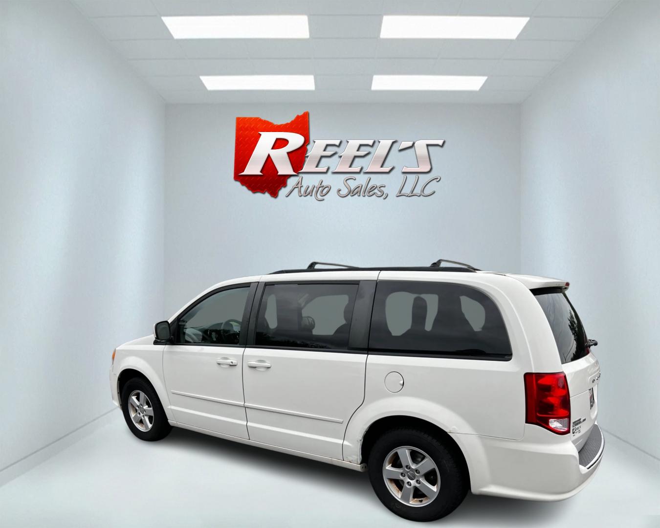 2011 White /Black Dodge Grand Caravan Mainstreet (2D4RN3DG9BR) with an 3.6L V6 DOHC 24V FFV engine, 6-Speed Automatic transmission, located at 547 E. Main St., Orwell, OH, 44076, (440) 437-5893, 41.535435, -80.847855 - This 2011 Dodge Grand Caravan Mainstreet offers a robust 3.6 Pentastar V6 engine paired with a 6-speed automatic transmission, providing a blend of power and efficiency, including flex-fuel capability. The minivan prioritizes convenience and comfort with features such as a power driver's seat, power - Photo#8