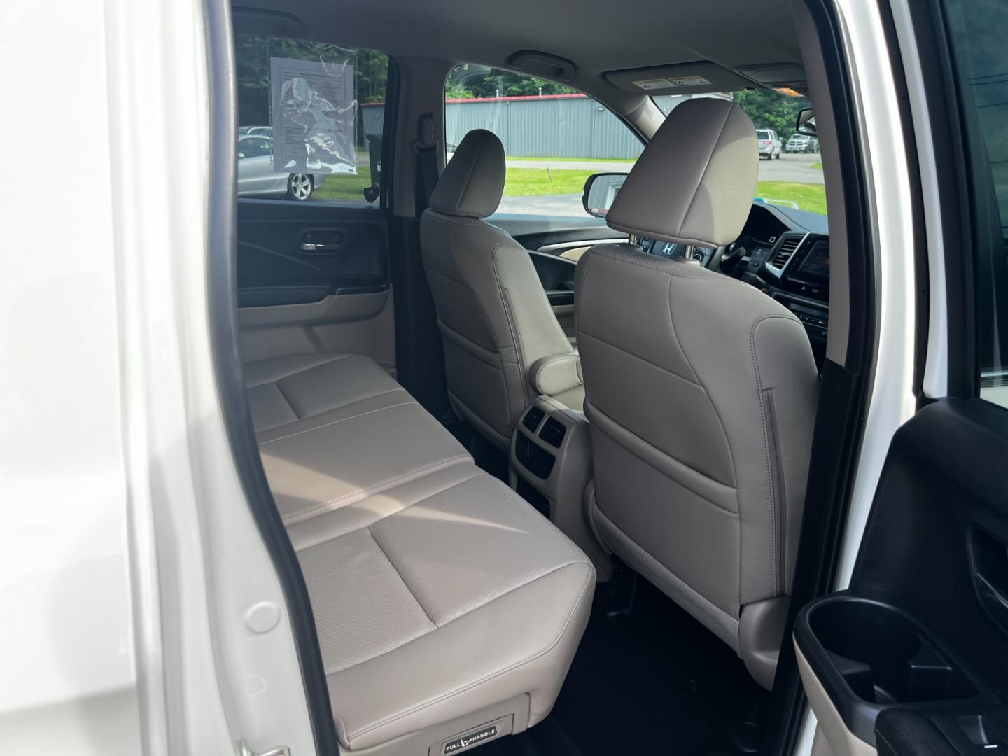 2017 White /Tan Honda Ridgeline RTL-T AWD (5FPYK3F61HB) with an 3.5L V6 SOHC 24V engine, 6-Speed Automatic transmission, located at 11115 Chardon Rd. , Chardon, OH, 44024, (440) 214-9705, 41.580246, -81.241943 - This 2017 Honda Pilot Ridgeline RTL-T AWD is powered by a 3.5 SOHC VTEC V6 engine paired with a 6-speed automatic transmission and offers selectable drive modes. It features LED daytime running lights, tri-zone automatic climate control, and a towing capacity of 5,000 pounds. Safety and convenience - Photo#46