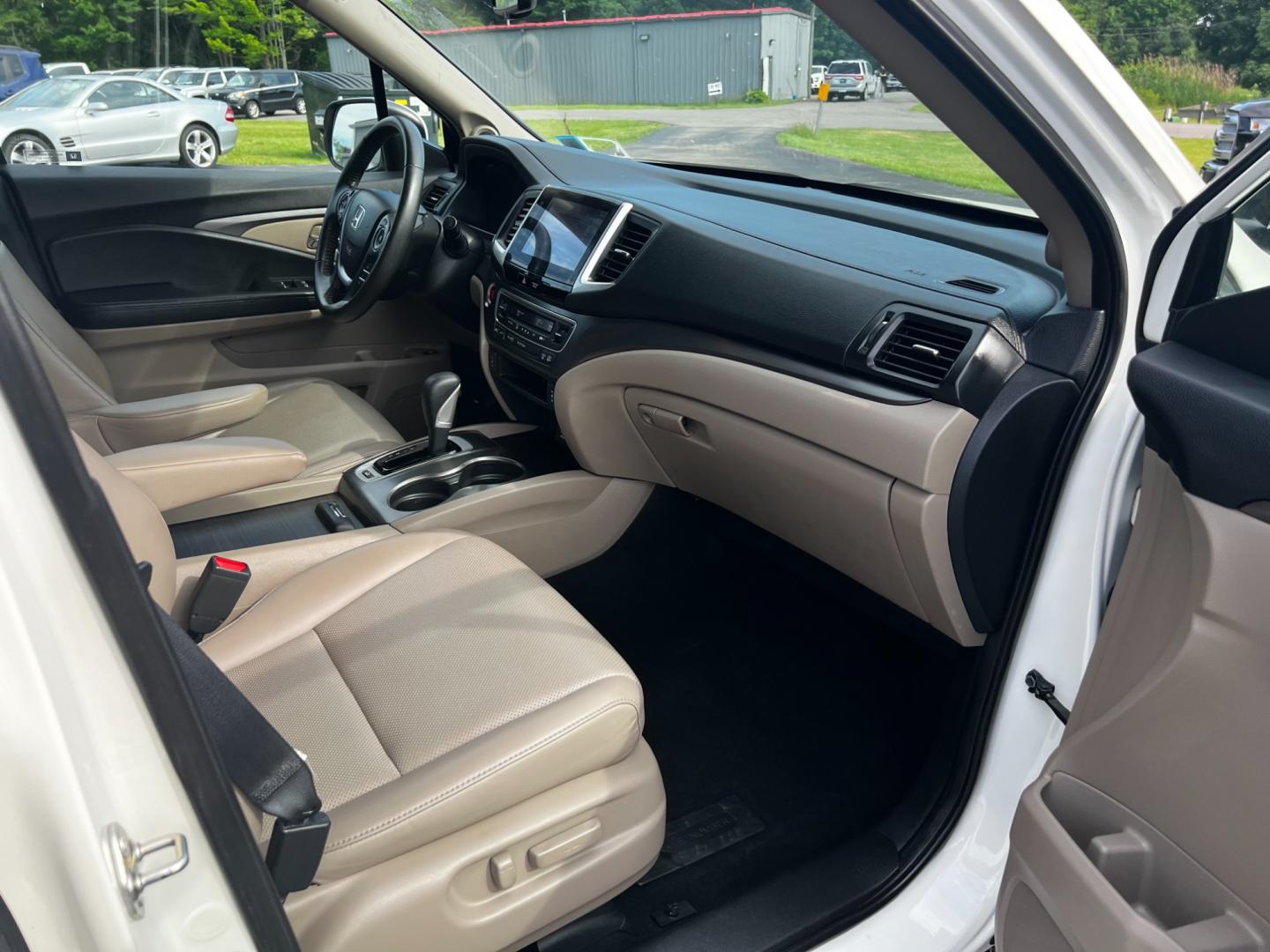 2017 White /Tan Honda Ridgeline RTL-T AWD (5FPYK3F61HB) with an 3.5L V6 SOHC 24V engine, 6-Speed Automatic transmission, located at 11115 Chardon Rd. , Chardon, OH, 44024, (440) 214-9705, 41.580246, -81.241943 - This 2017 Honda Pilot Ridgeline RTL-T AWD is powered by a 3.5 SOHC VTEC V6 engine paired with a 6-speed automatic transmission and offers selectable drive modes. It features LED daytime running lights, tri-zone automatic climate control, and a towing capacity of 5,000 pounds. Safety and convenience - Photo#48