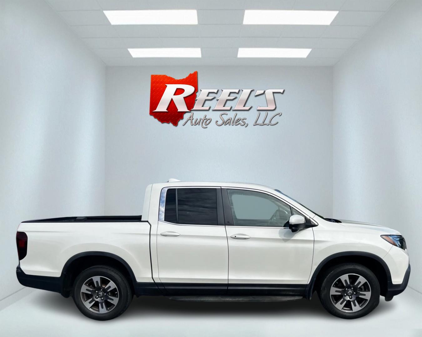 2017 White /Tan Honda Ridgeline RTL-T AWD (5FPYK3F61HB) with an 3.5L V6 SOHC 24V engine, 6-Speed Automatic transmission, located at 11115 Chardon Rd. , Chardon, OH, 44024, (440) 214-9705, 41.580246, -81.241943 - This 2017 Honda Pilot Ridgeline RTL-T AWD is powered by a 3.5 SOHC VTEC V6 engine paired with a 6-speed automatic transmission and offers selectable drive modes. It features LED daytime running lights, tri-zone automatic climate control, and a towing capacity of 5,000 pounds. Safety and convenience - Photo#4